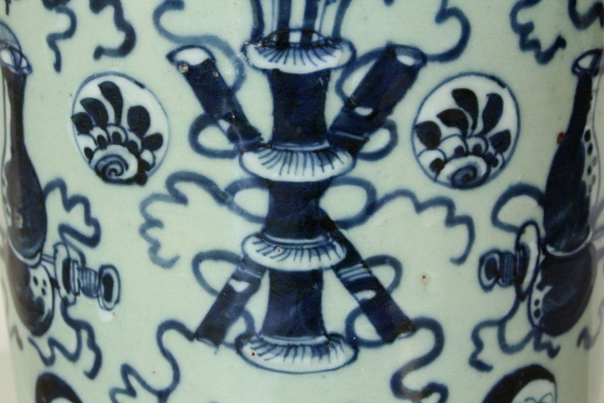Chinese porcelain large baluster vase decorated in a rich underglaze blue pattern on a celadon glazed ground.