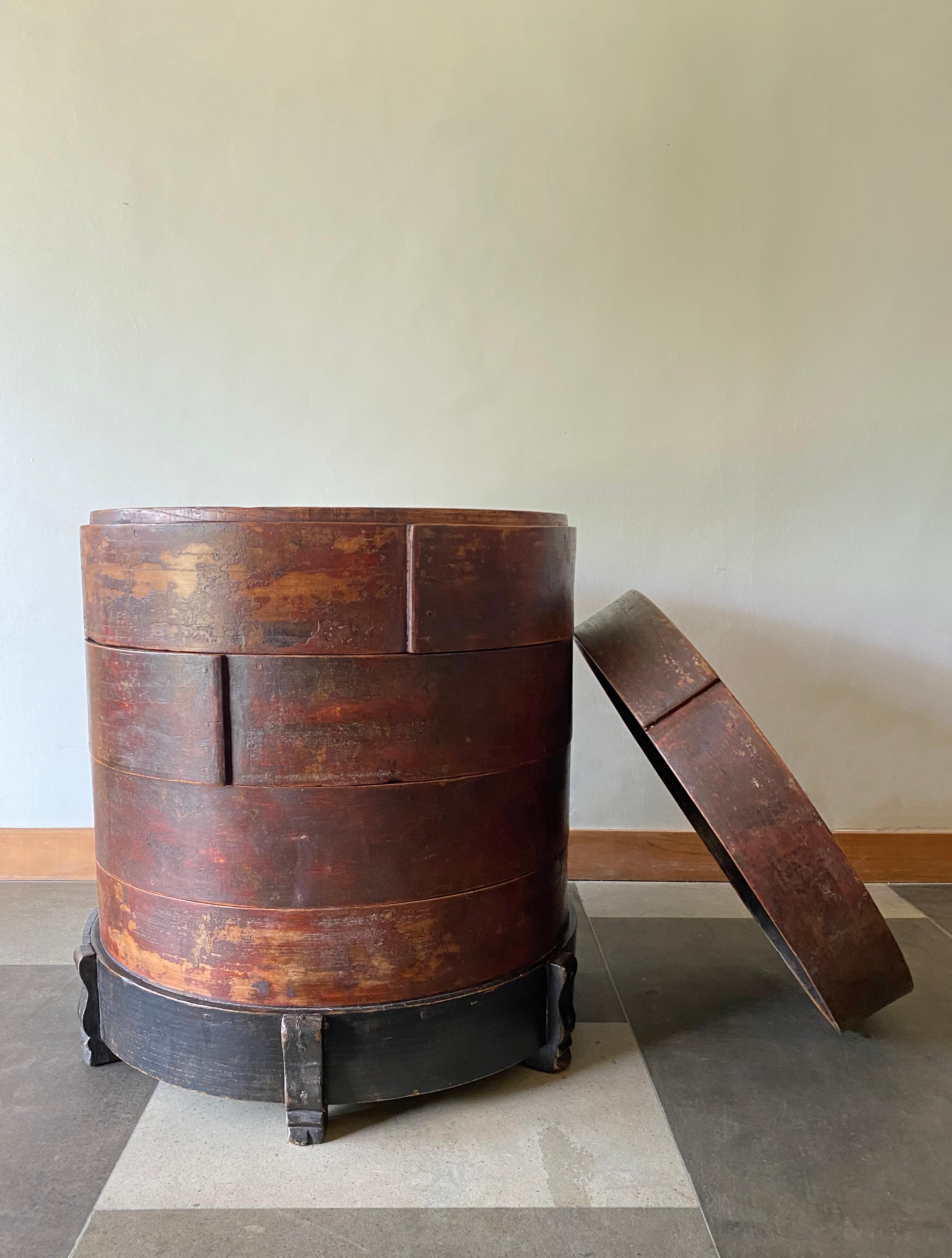 This is an exceptionally rare and unique piece. An antique, multilayered, storage container once used by street vendors to store Baozi/Bao, the filled Buns typically consumed in large parts of China. Despite its once utilitarian function its