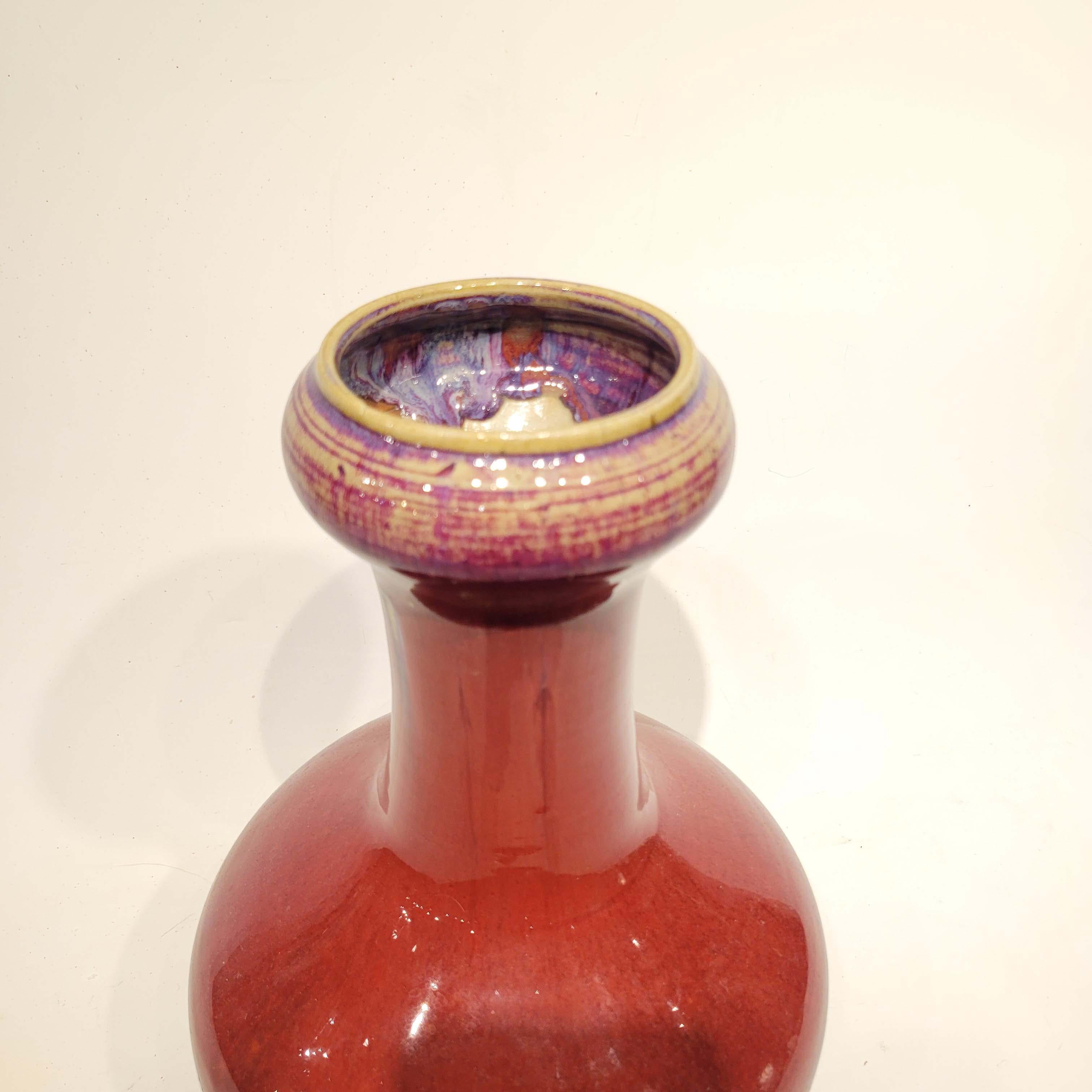 A wonderful and early Chinese ox blood garlic neck vase, signed under the base.
The vase has a crack around the body and a crack running down the neck and is sold as is.