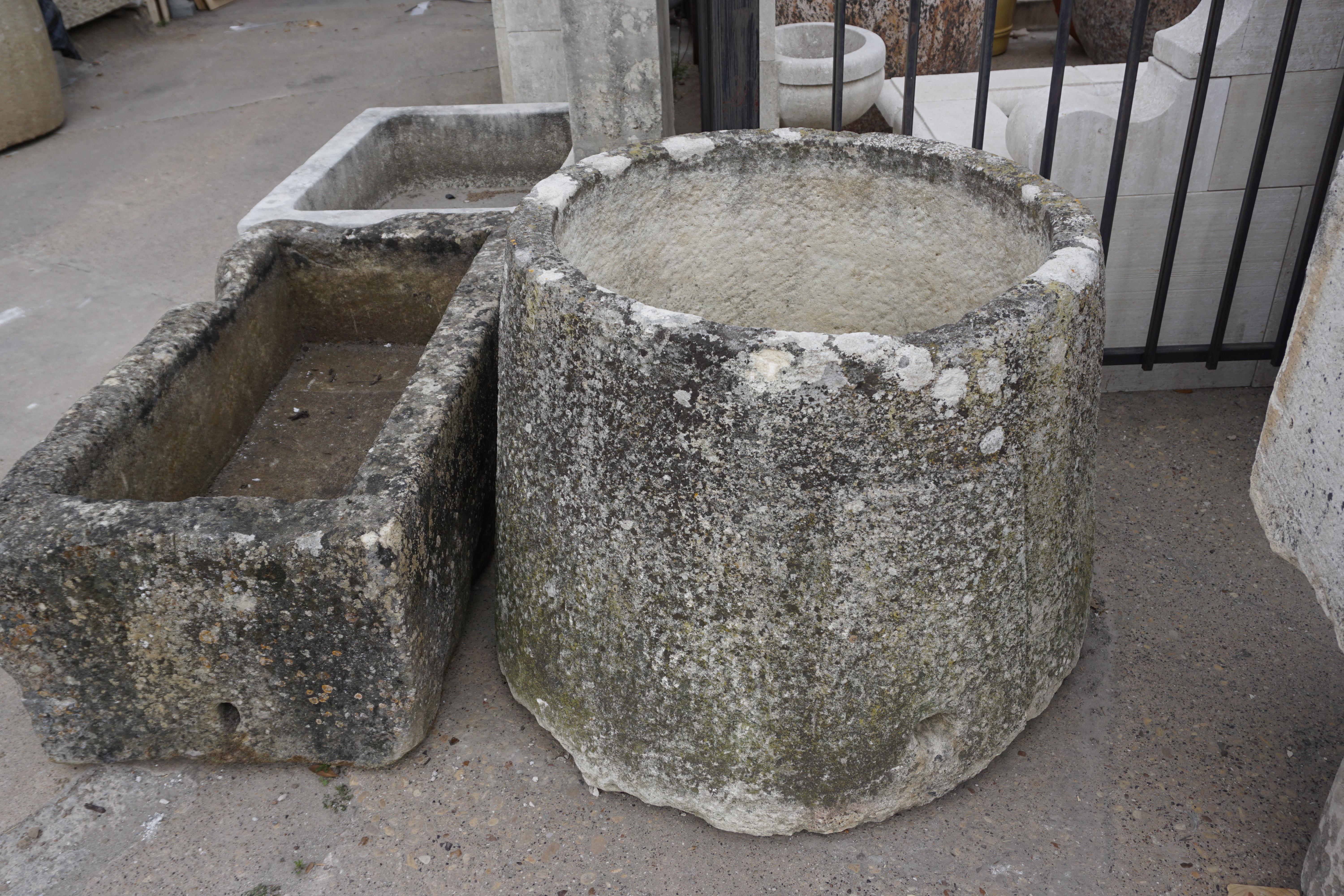 This large round trough is a sturdy addition to any outdoor space. Originates from France, circa 1700.