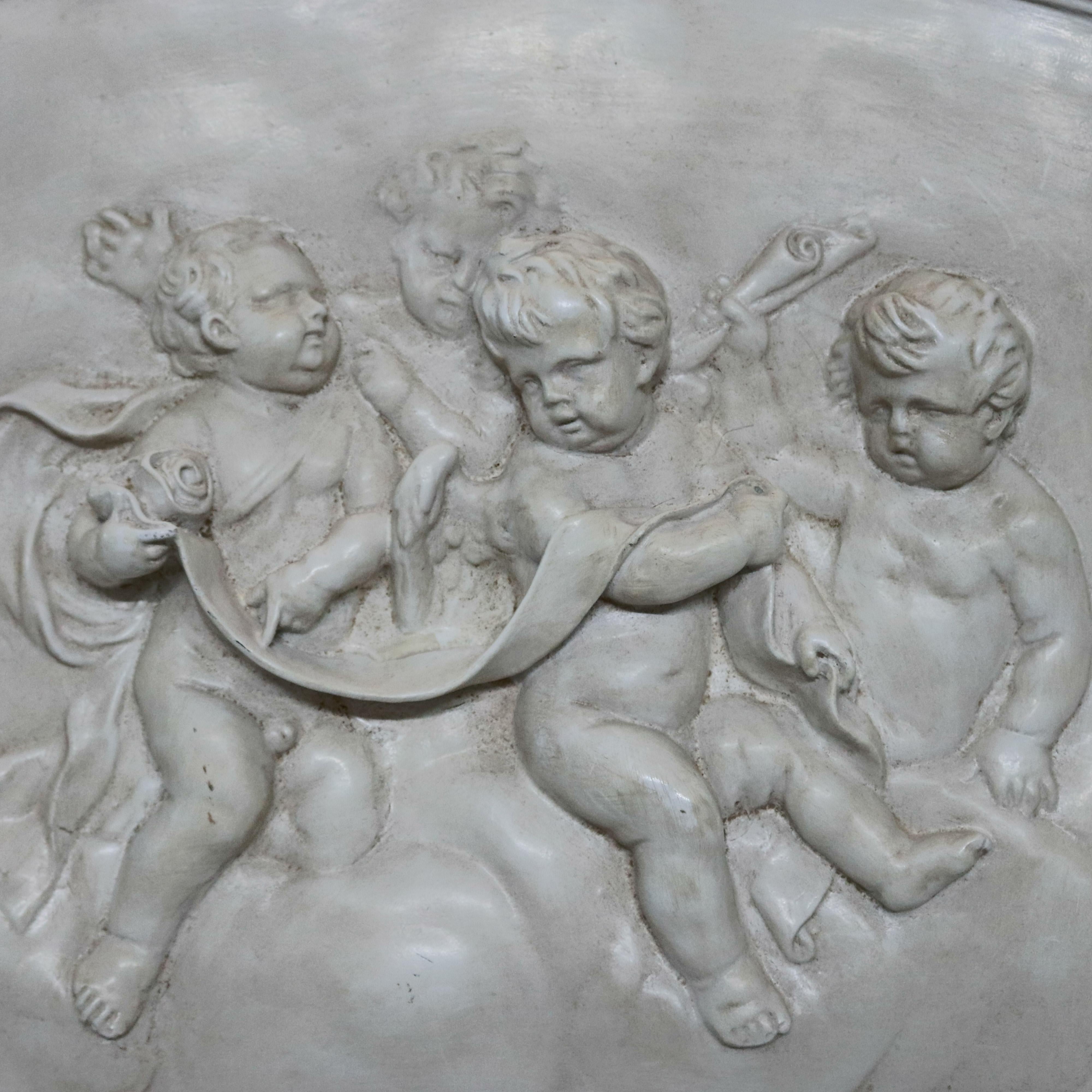 A large antique classical crescent form plaque offers high relief cherub scene, en verso with mounting wire, circa 1930

***DELIVERY NOTICE – Due to COVID-19 we are employing NO-CONTACT PRACTICES in the transfer of purchased items.  Additionally,
