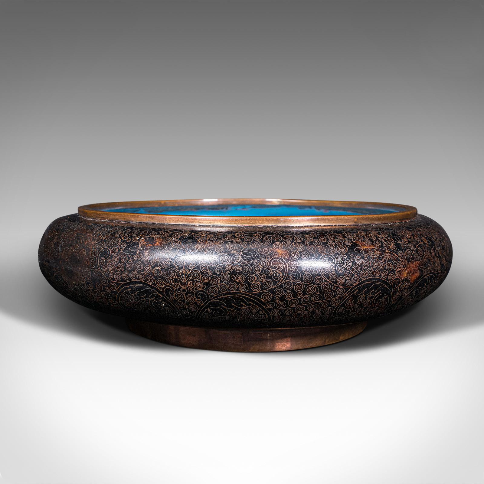 Our Stock # 18.7749

This is a large antique cloisonne bowl. A Chinese, ceramic fishbowl or serving dish, dating to the late Victorian period, circa 1900.

Striking example of cloisonne with vibrant colour palette
Displays a desirable aged