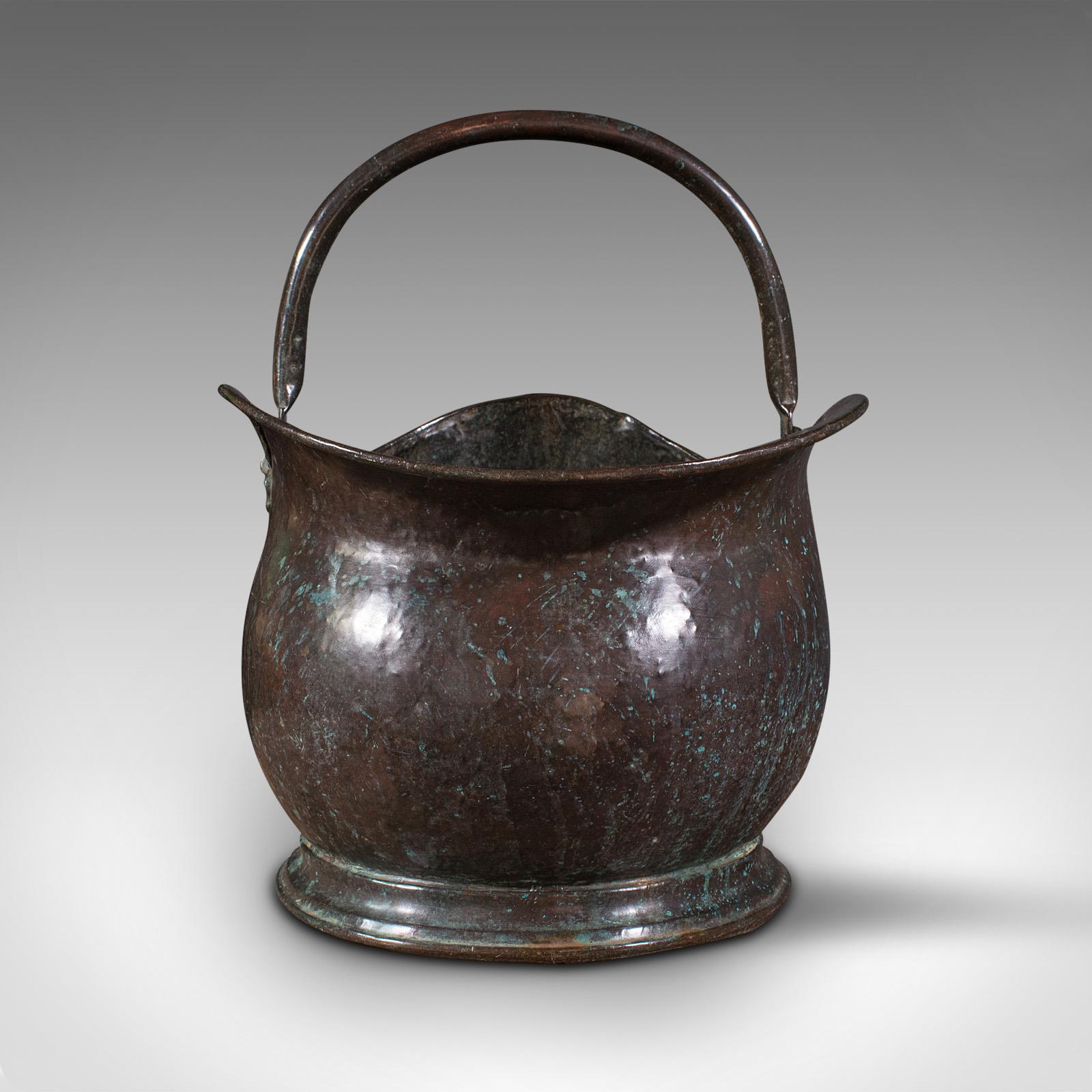 This is a large antique coal bucket. An English, delightfully weathered copper fireside scuttle, dating to the Georgian period, circa 1800.

Superb fireside bucket with appealing finish and generous proportion
Displays a desirable aged patina