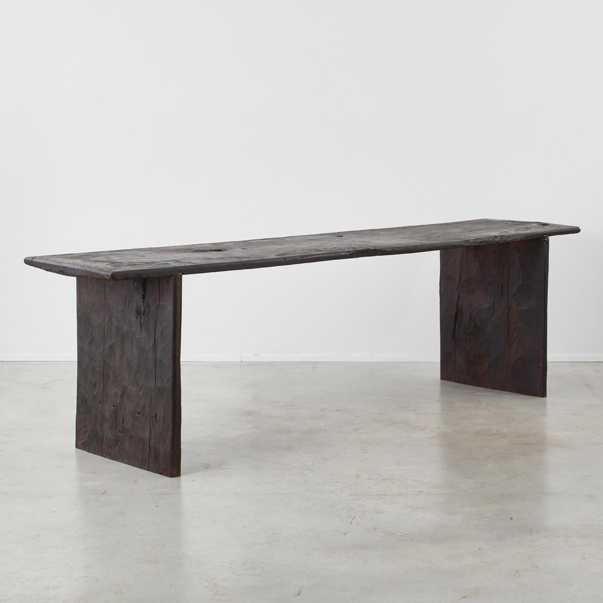 This large console table is comprised of rare 18th century Spanish boards which were assembled in London in 2021. The construction is rudimentary but incredibly solid, and it expresses a strangely contemporary form.

The table is finished with a