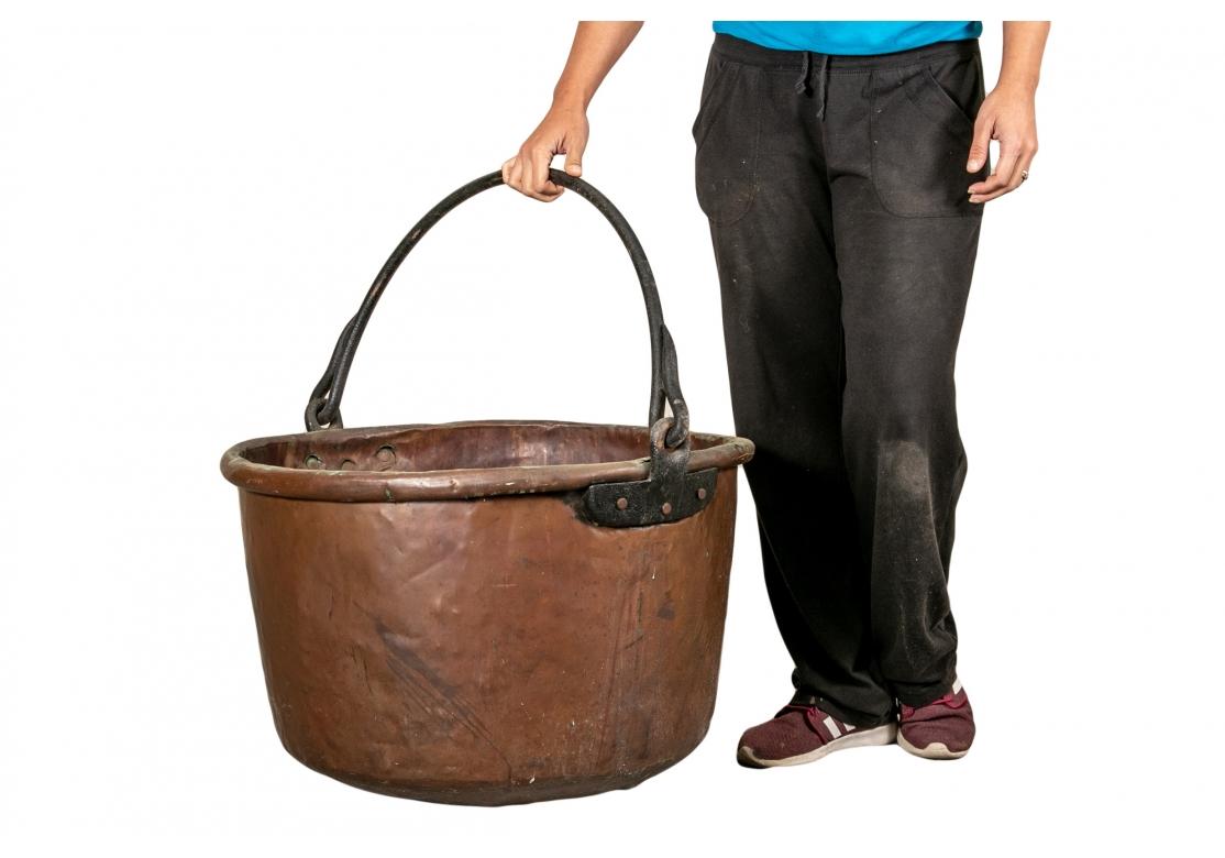 An authentic and very large copper cauldron in as found original condition. large handled with iron swivel handle and attachments. A round bottom.
Condition: Please see all detail photos. corrosion line inside, tarnished overall and some dents, as