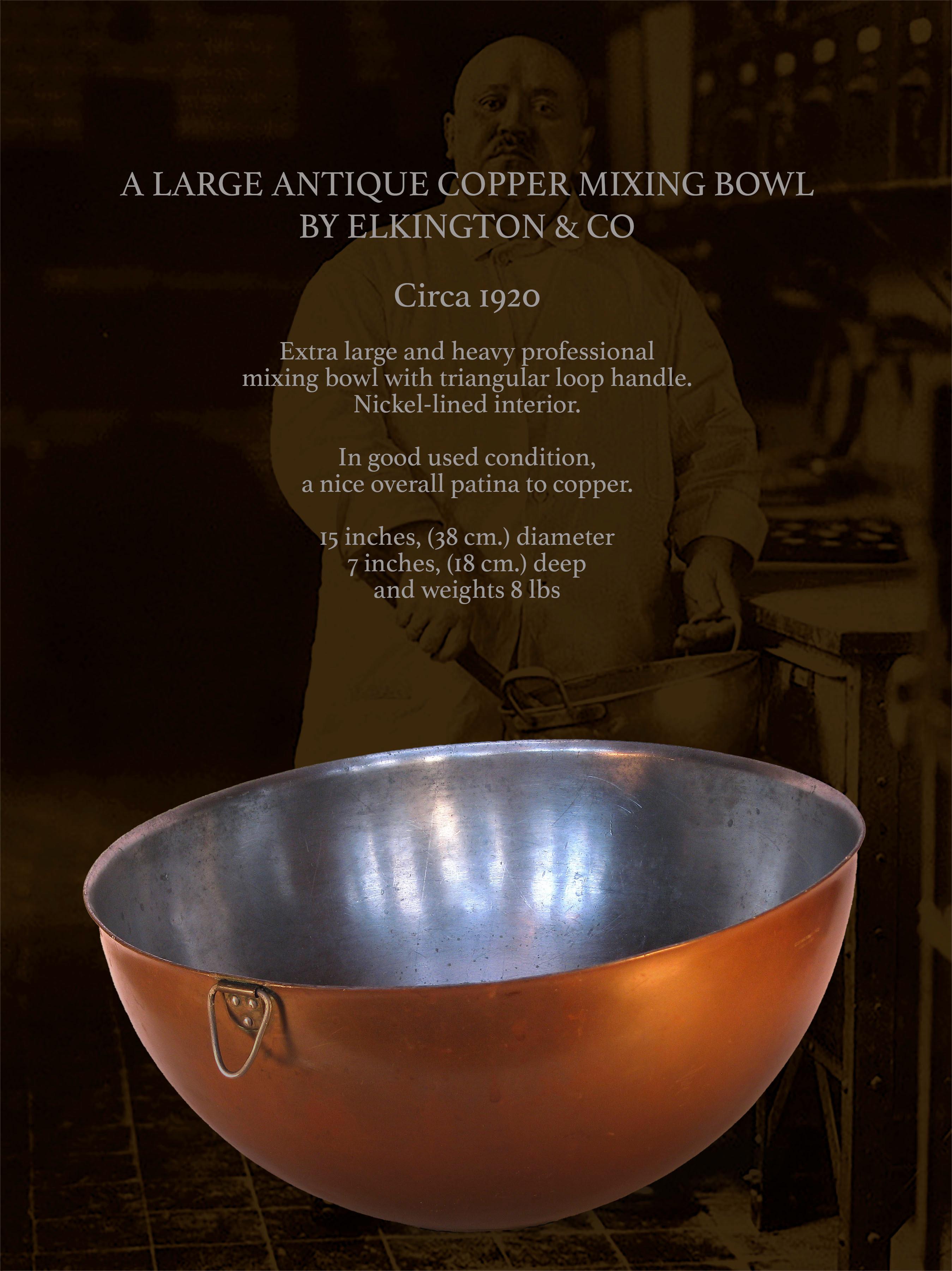 A LARGE ANTIQUE COPPER MIXING BOWL
BY ELKINGTON & CO

Circa 1920

Extra large and heavy professional
mixing bowl with triangular loop handle.
Interior appears to have somewhat
a harder coating, possibly a nickel.

In good used condition,
a nice