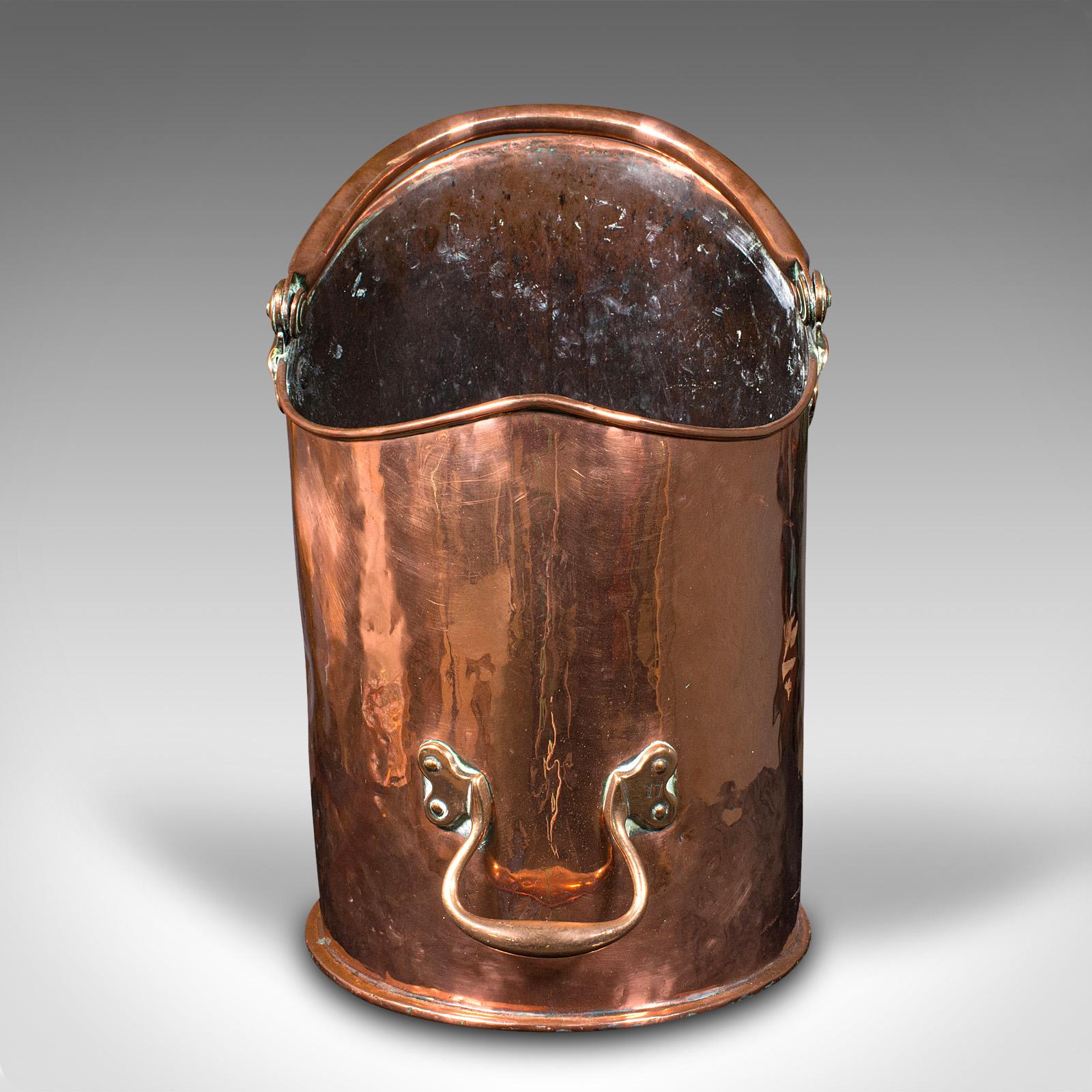 This is a large antique country house coal bin. An English, copper fireside fuel keeper, dating to the early Victorian period, circa 1850.

Appealing proportion, with generous storage to attend to the needs of the larger fire
Displays a desirable