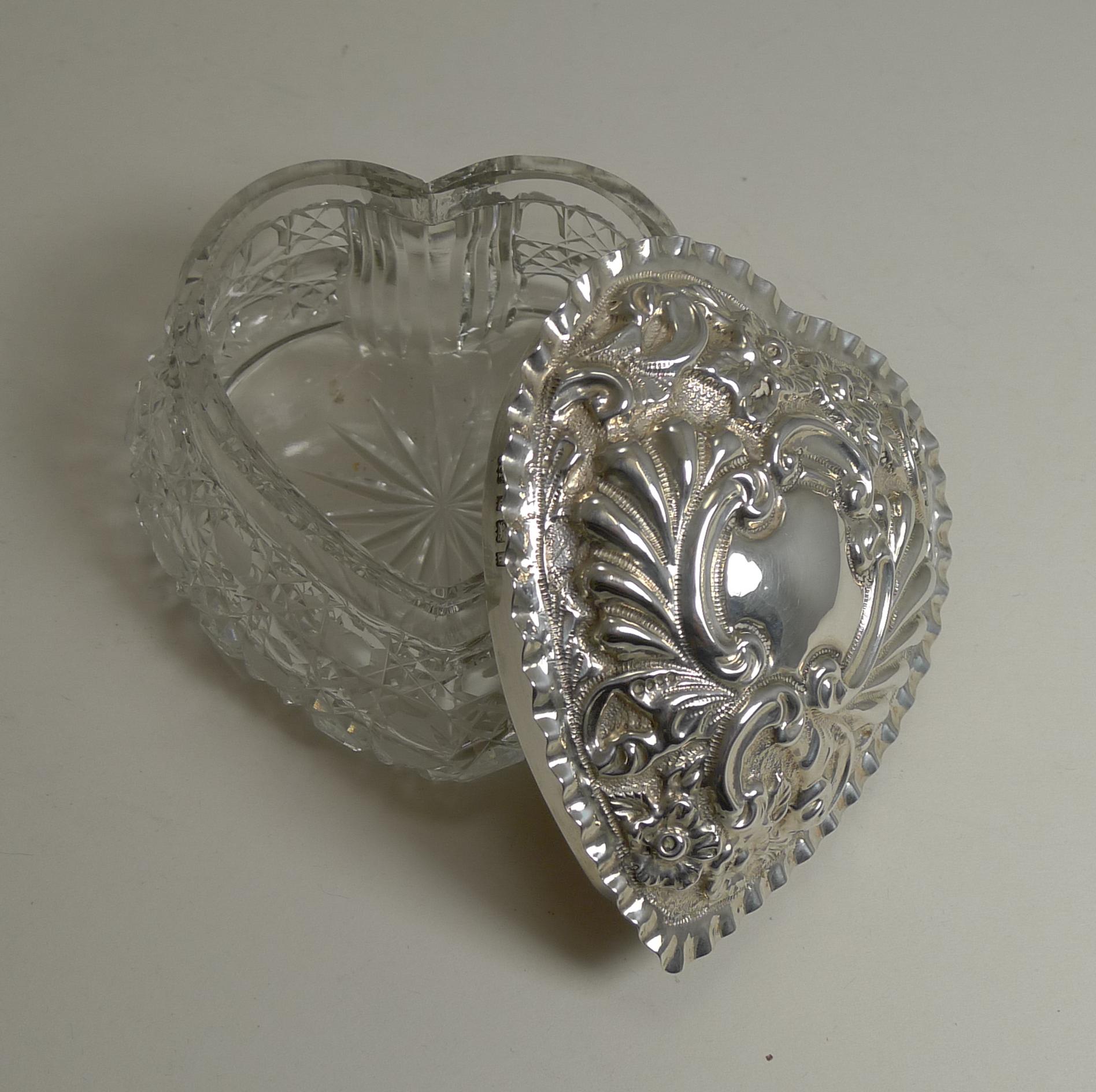 A romantic example of an Edwardian heart shaped trinket box made from a heavy thick piece of crystal beautifully cut in the ever-popular hobnail design with a star cut to the base.

The solid or sterling silver lid is excellent quality with a deep