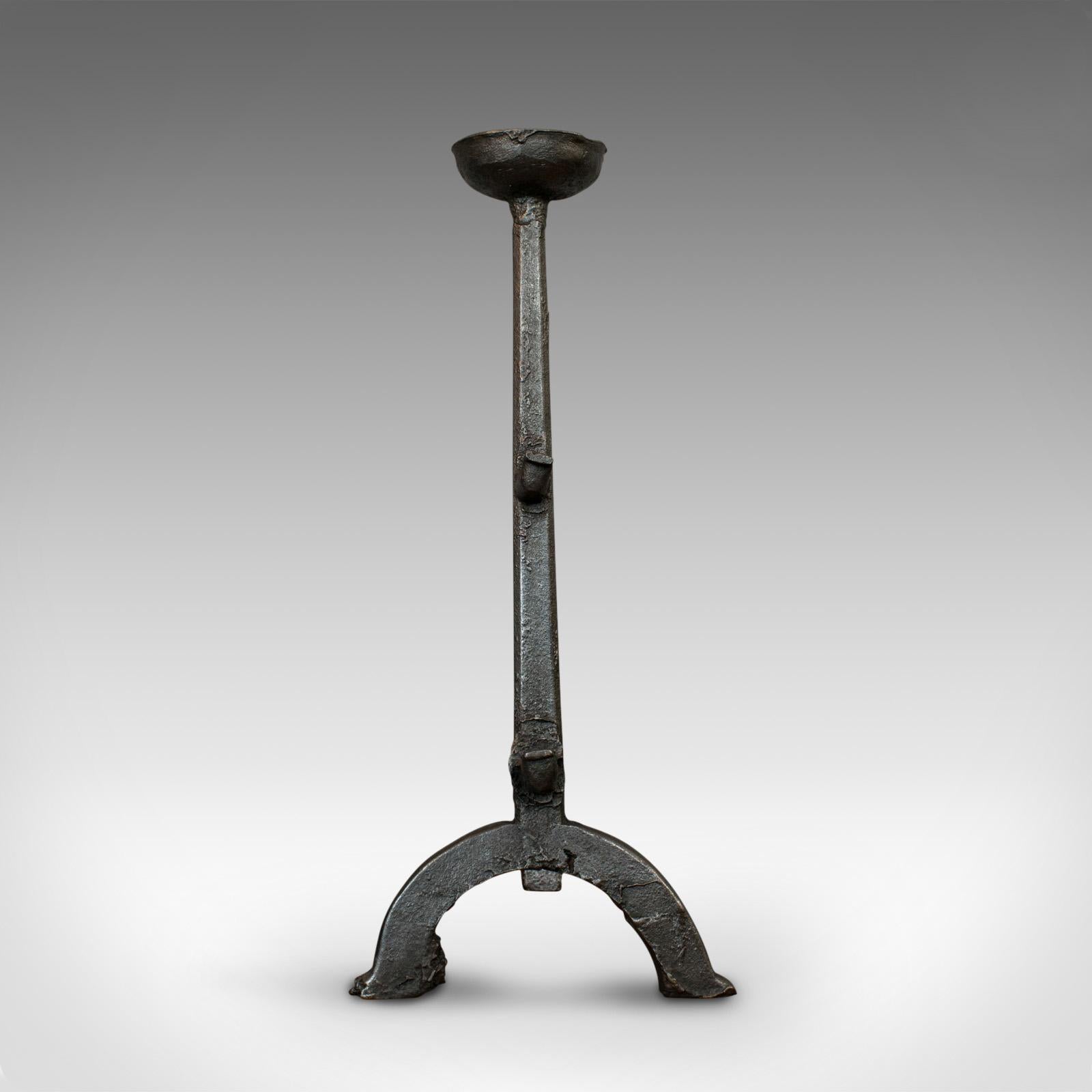 This is a large antique decorative andiron. An English, cast iron fireside firedog or candle stand, dating to the Georgian period, circa 1800.

Classic Georgian fireside interest
Displays a desirable aged patina
Cast iron in good order with