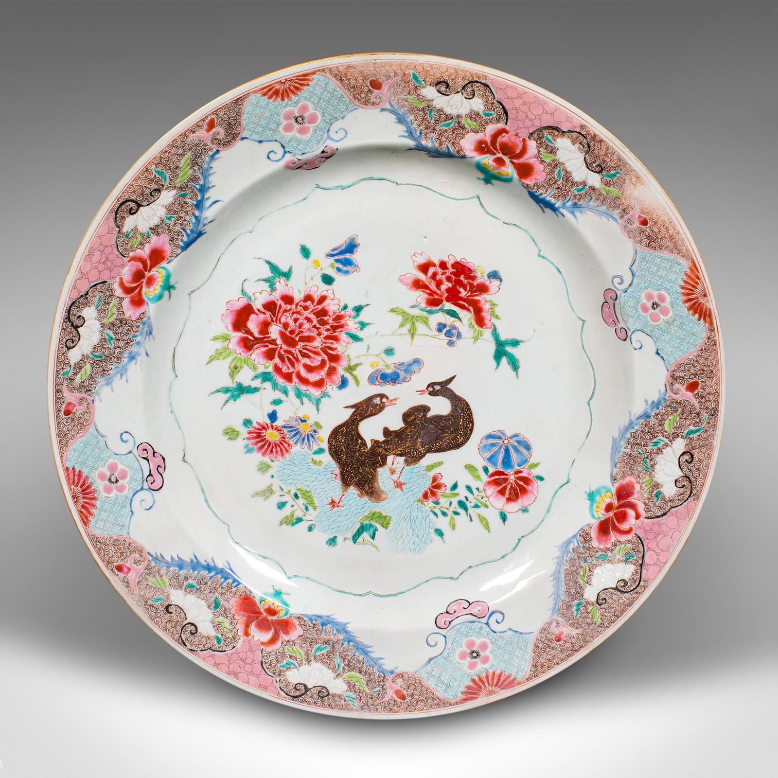 This is a large antique decorative charger. A Japanese, ceramic serving plate, dating to the early 20th century, circa 1920.

Pleasing coloration and of a generous serving size
Display a desirable aged patina throughout
Quality ceramic presents a