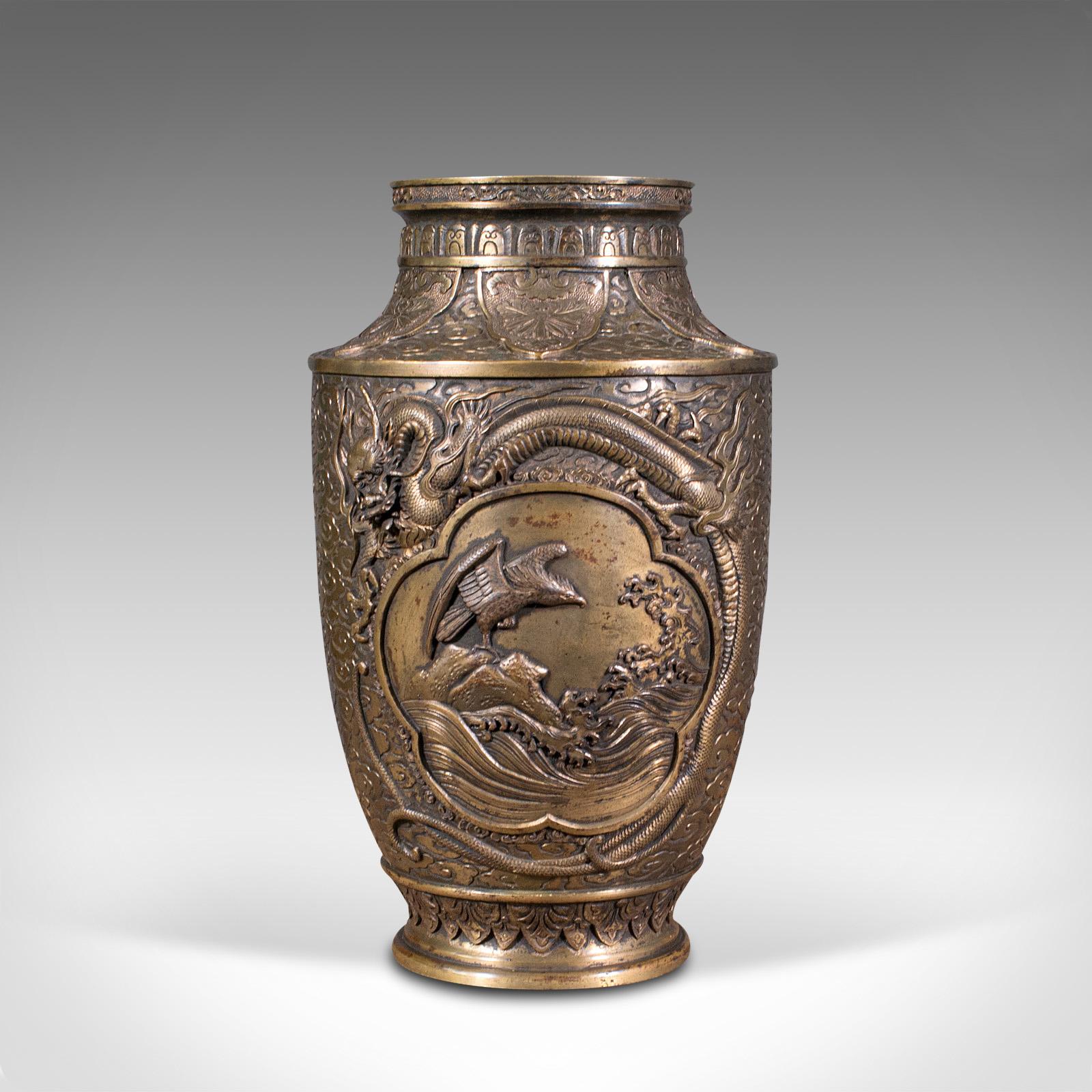 This is a large antique decorative vase. A Japanese, bronze Meiji period urn, dating to the late Victorian period, circa 1900.

Highly impressive antique vase with striking detail
Displays a desirable aged patina by way of fine weathering
Bronze