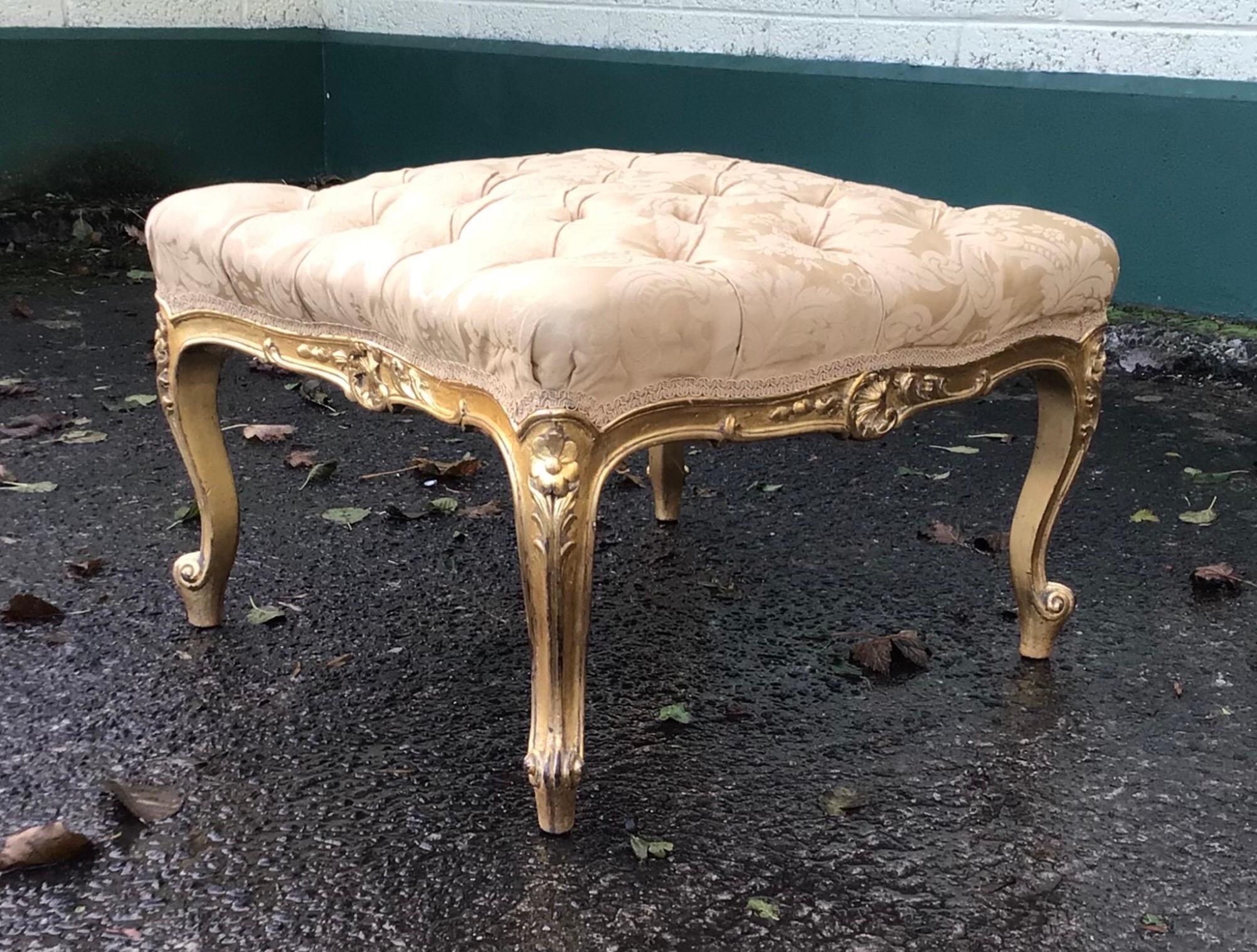 Beautiful deep buttoned reupholstered large antique gilt stool 

Measures: 26.5 ins. x 26.5 ins. x 16 ins. high.
 
