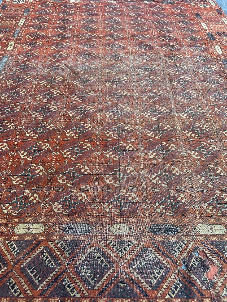 Pretty large early 20th century Turkish Sparta rug with beautiful geometrical and tribal design of Bokhara rugs and nice colours with a red orange background and grey, purple and beige in design, entirely hand knotted with wool on cotton foundation.