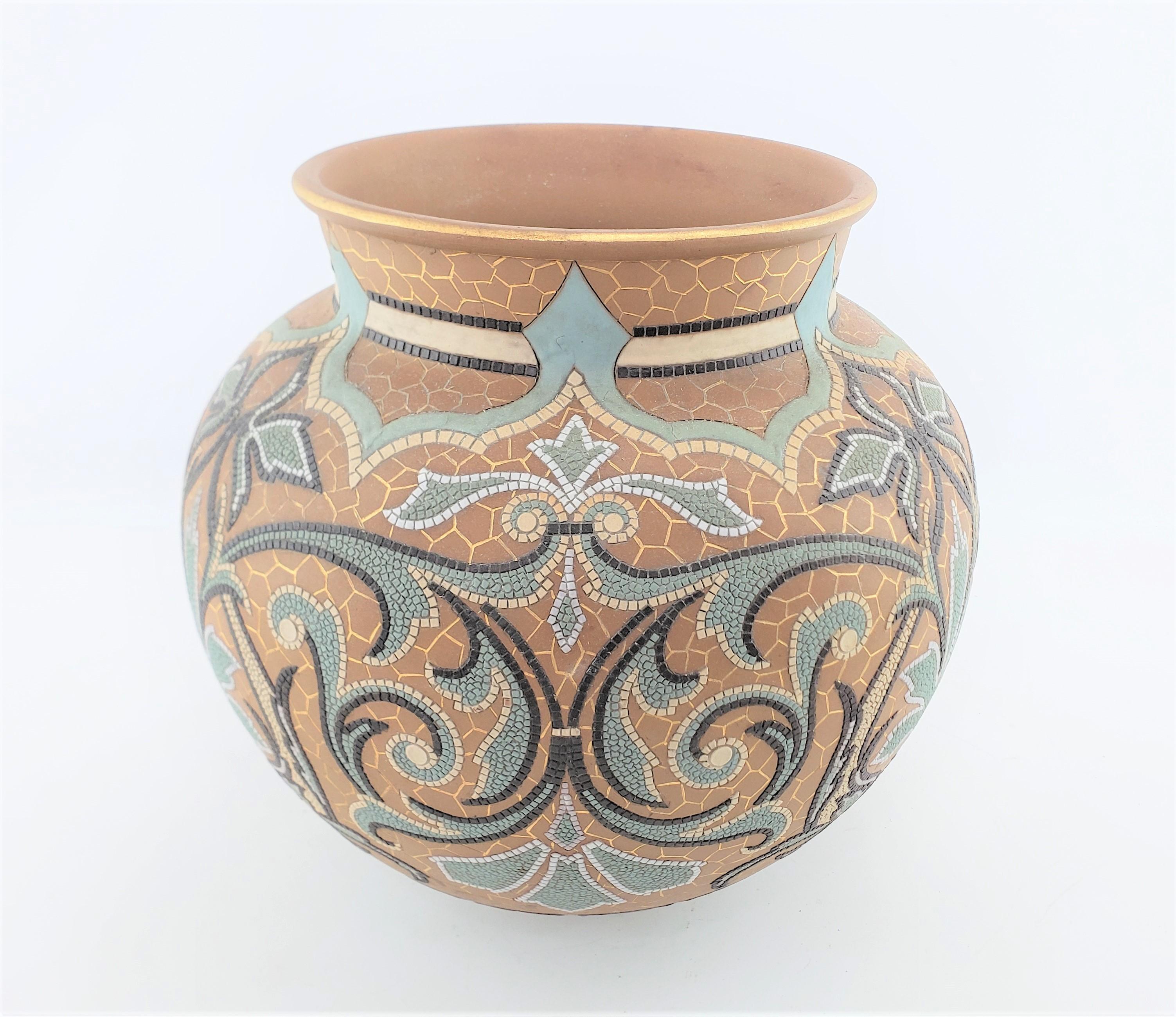 This large antique art pottery vase was done by the highly renowned Doulton Lambeth factory of England in approximately 1880 in a period Victorian style. The vase is done in muted pastel tones with a brown stoneware ground in their 'Silicon'