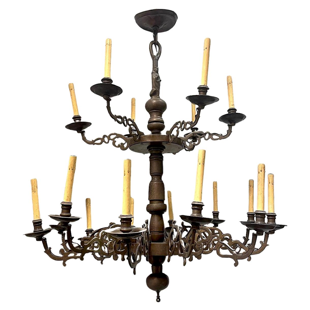 A circa 1900 Dutch 18 lights patinated bronze double tiered chandelier

Measurements:
Min. drop: 45