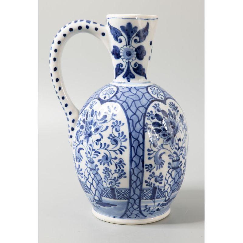 A superb large antique Delft faience cobalt blue and white flower pot pitcher by Boch Keramis, a well-known Belgian maker. Signed on the reverse. This gorgeous wine jug or ewer has a wonderful lobed shape and is finely hand painted with a floral
