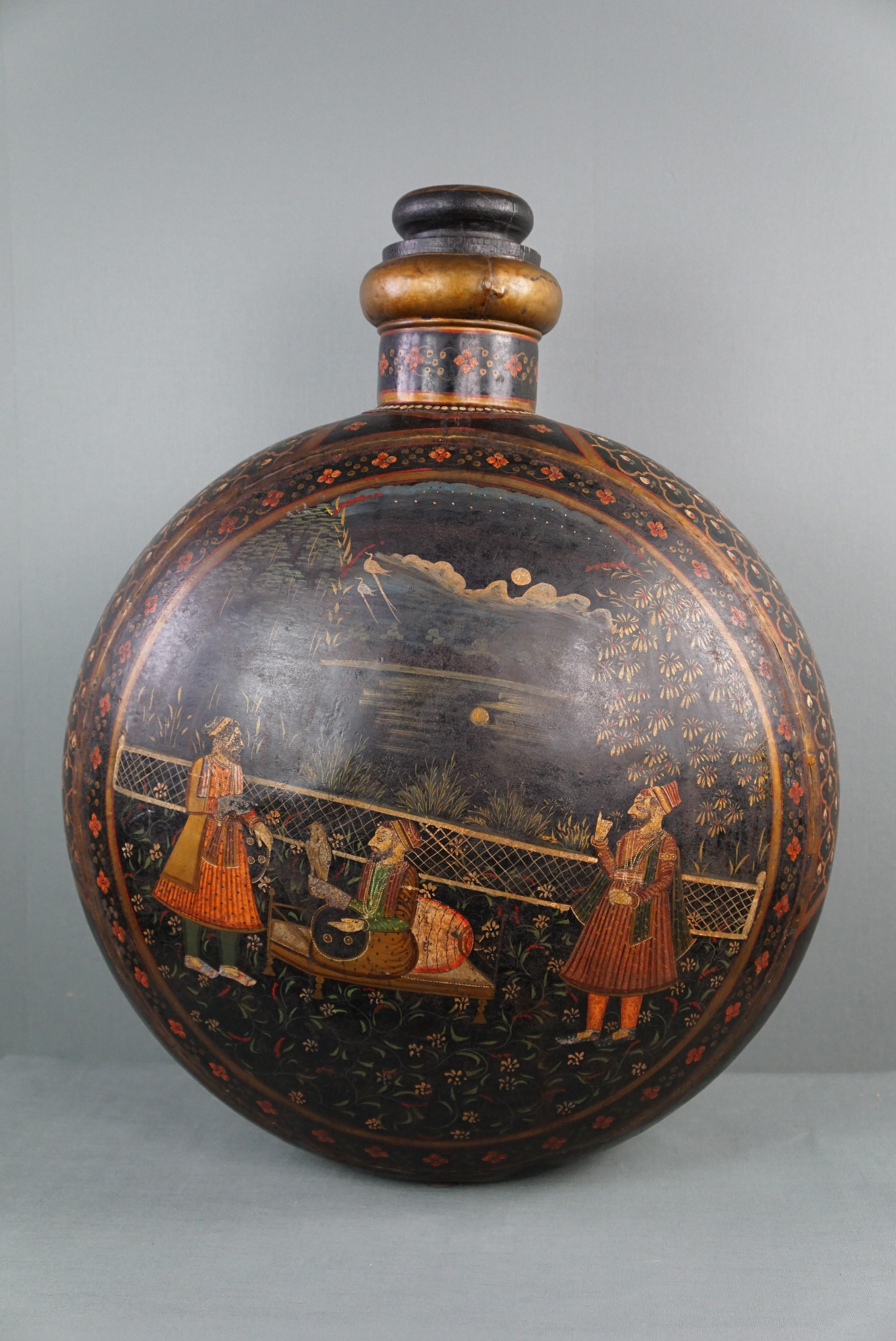 Offered is this beautiful and very large antique early 20th century hand-painted Indian water vessel which, due to its decorations, size and details, is an asset to many interiors.

This large painted metal vessel is decorated with polychrome