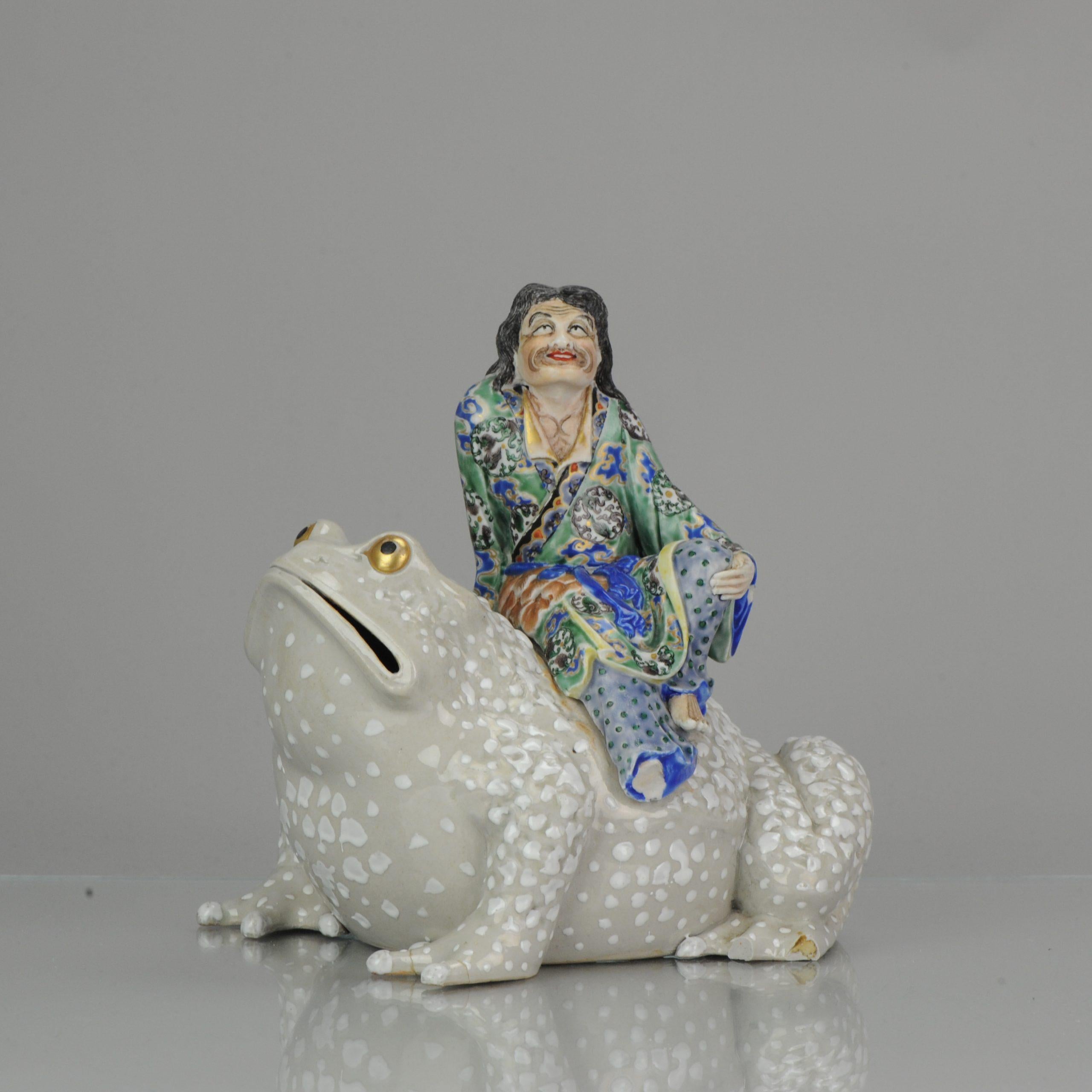 Large, lovely and very nicely handcrafted.
An unusual large enameled Koro of Liu Hai seated atop a massive three-legged toad with raised lumps on its skin. The immortal dressed in robes tied at the waist and left open exposing his chest. He has an