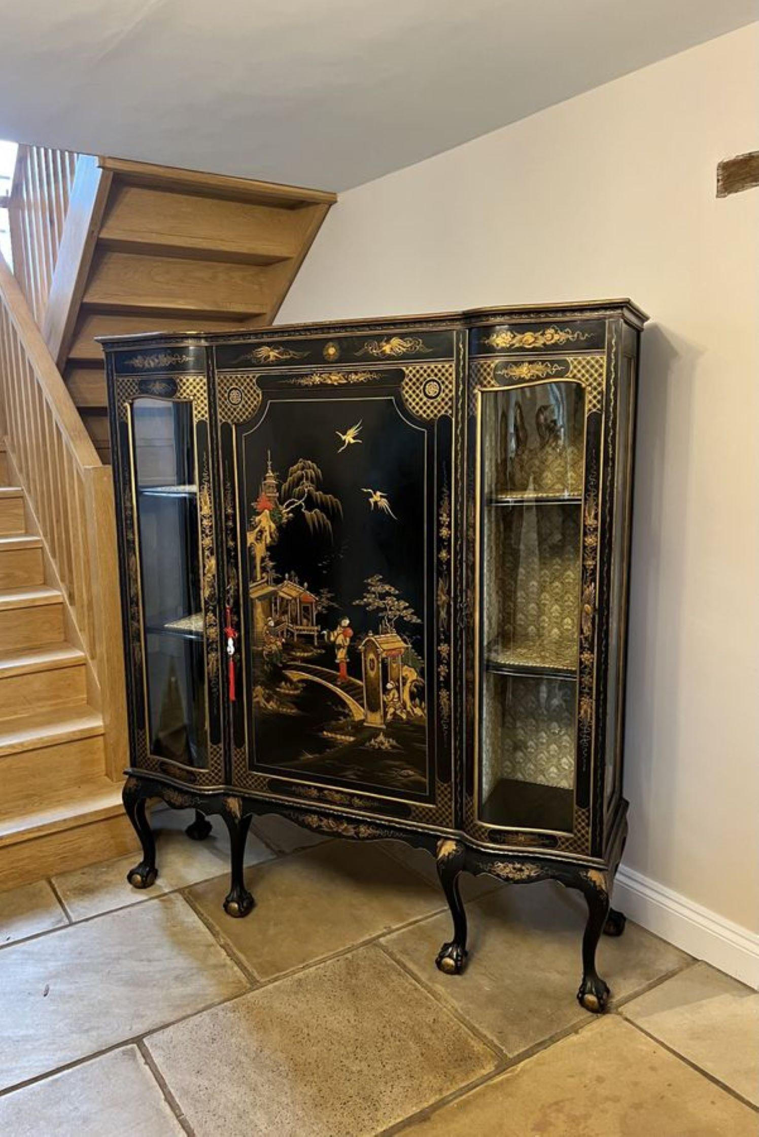 Large antique Edwardian quality chinoiserie decorated display cabinet, having an outstanding quality black, red and gold chinoiserie decorated door to the centre opening to reveal a storage compartment flanked by a pair of serpentine shaped