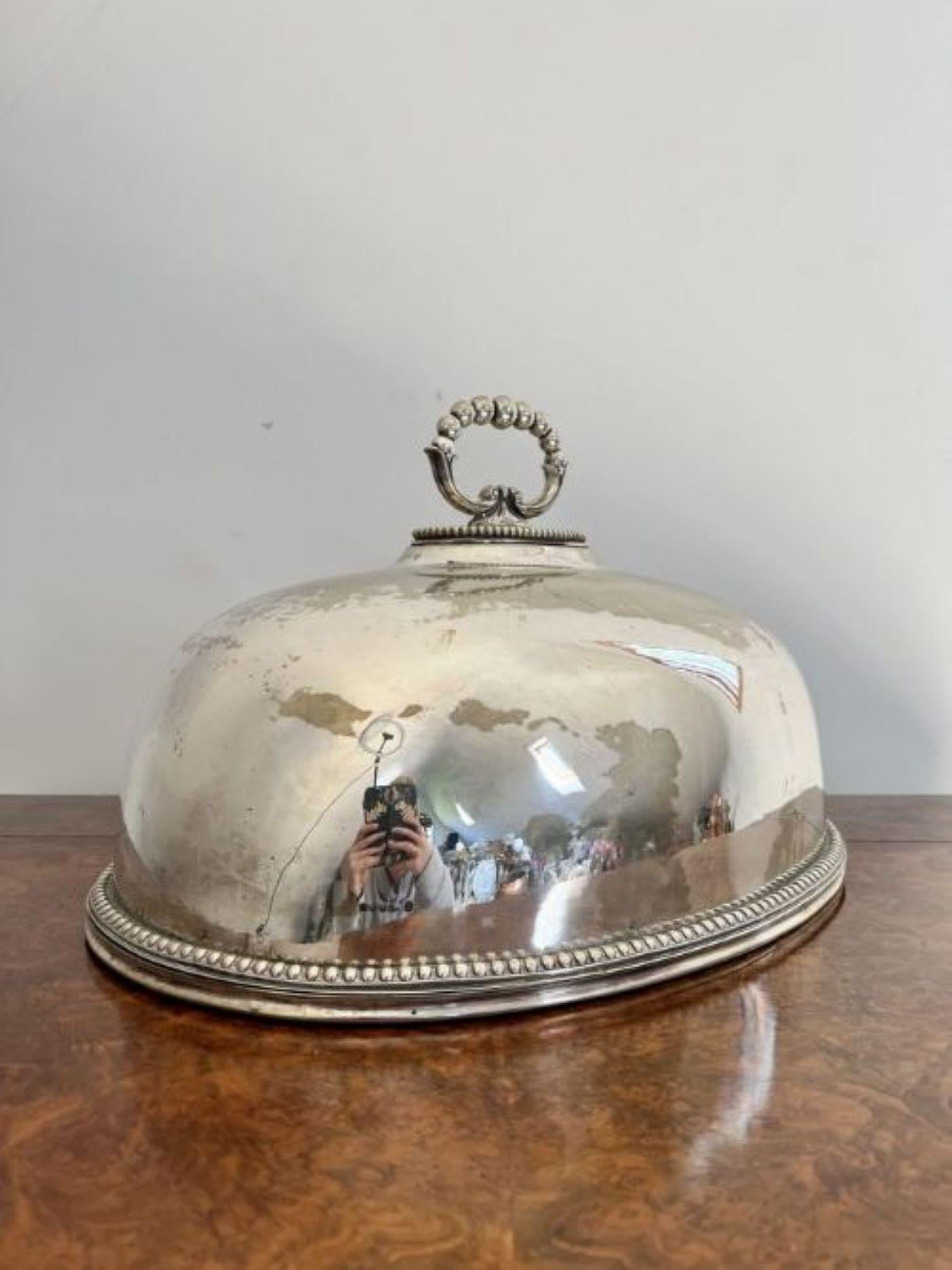 Large antique Edwardian quality silver plated meat cover having a quality antique Edwardian silver plated meat cover with an ornate shaped handle to the top, with quality beaded decoration to the dome shaped cover.