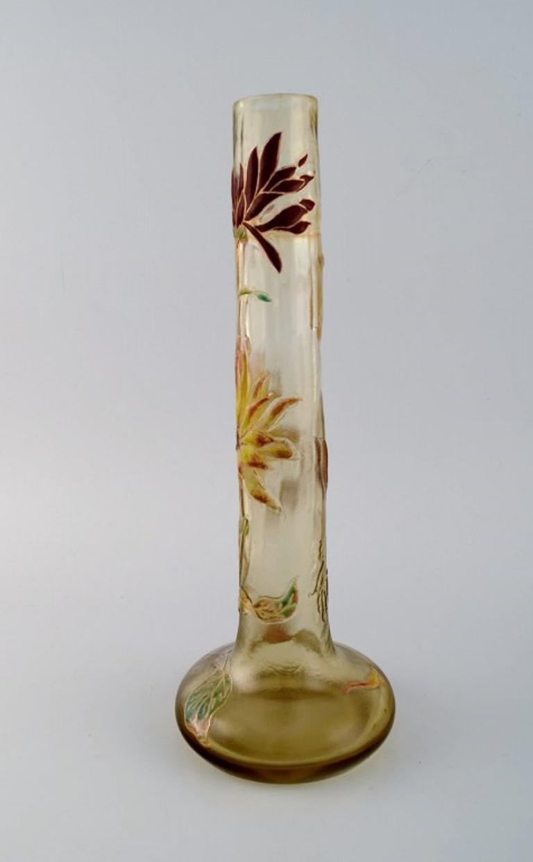 Large antique Emile Gallé Japanism vase in clear frosted art glass. 
Carved with motifs in the form of flowers and leaves in yellow and red. 
Museum quality, 1890s.
Measures: 34 x 12.5 cm.
Signed: Gallé (Japanism).
In excellent condition.