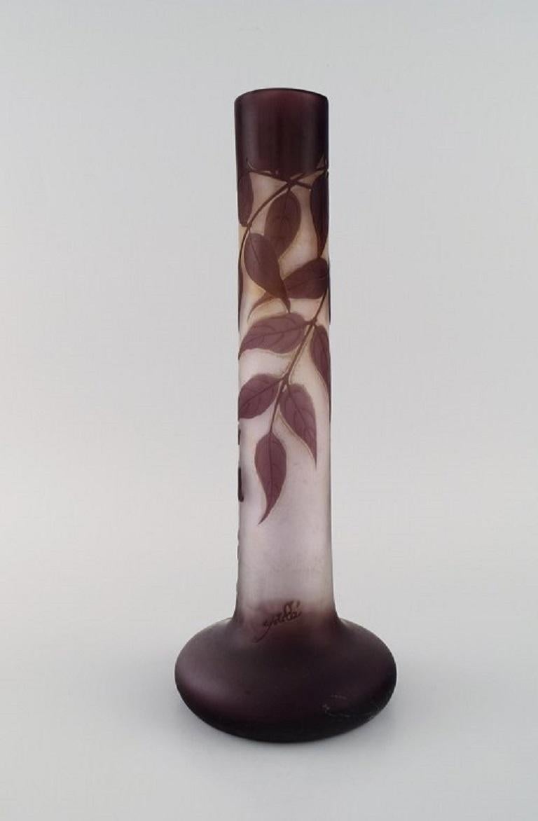 Large antique Emile Gallé vase in frosted and purple art glass carved in the form of foliage. 
Early 20th century.
Measures: 33 x 12.5 cm.
In excellent condition.
Signed.