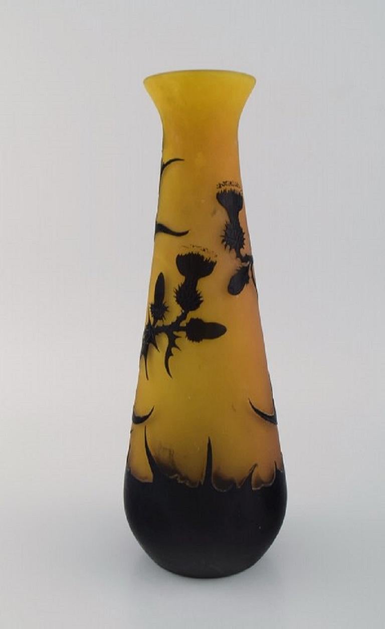 Large antique Emile Gallé vase in yellow and black art glass carved in the form of branches with foliage. 
Rare model. Early 20th century.
Measures: 30 x 11 cm.
In excellent condition.
Signed.