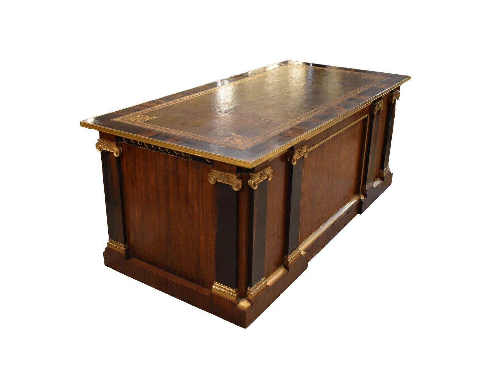 An Impressively large Calamander wooden antique desk. 

This quality crafted piece designed in a rare grand French Empire style with ormolu topped pilasters and vituvian scroll details. 

The drawers are mahogany fronted and oak lined with an
