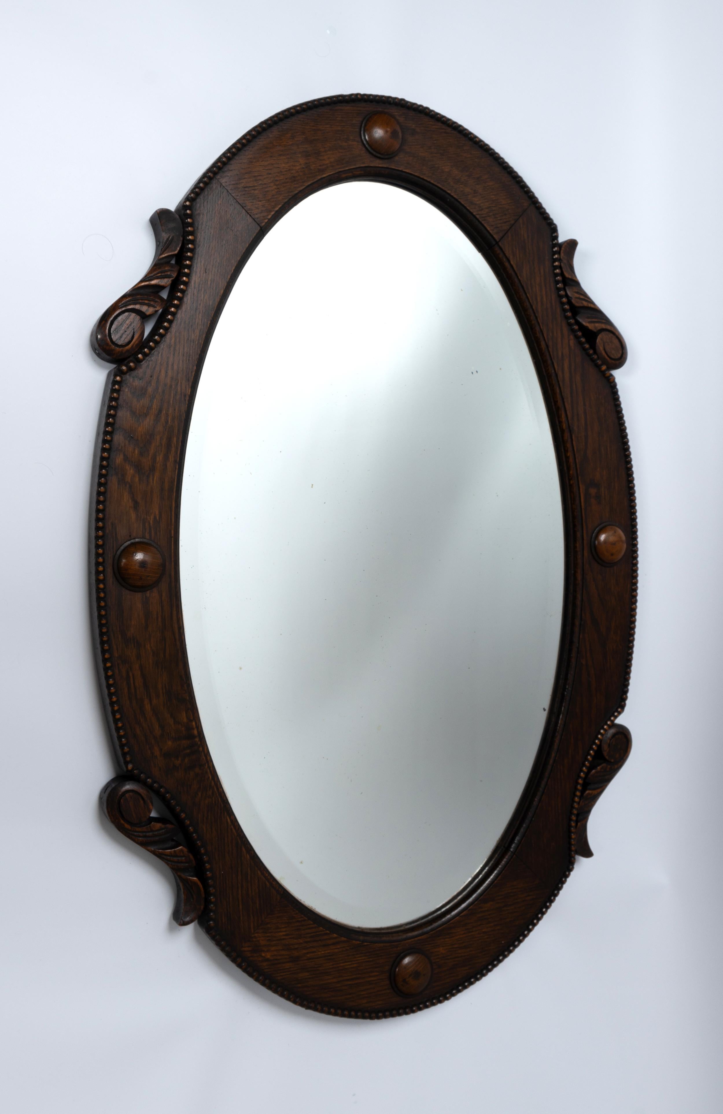 Large Antique English Arts And Crafts Oval Oak Framed Mirror C.1920 
Attractive carved detailing. In very good condition commensurate of age.
