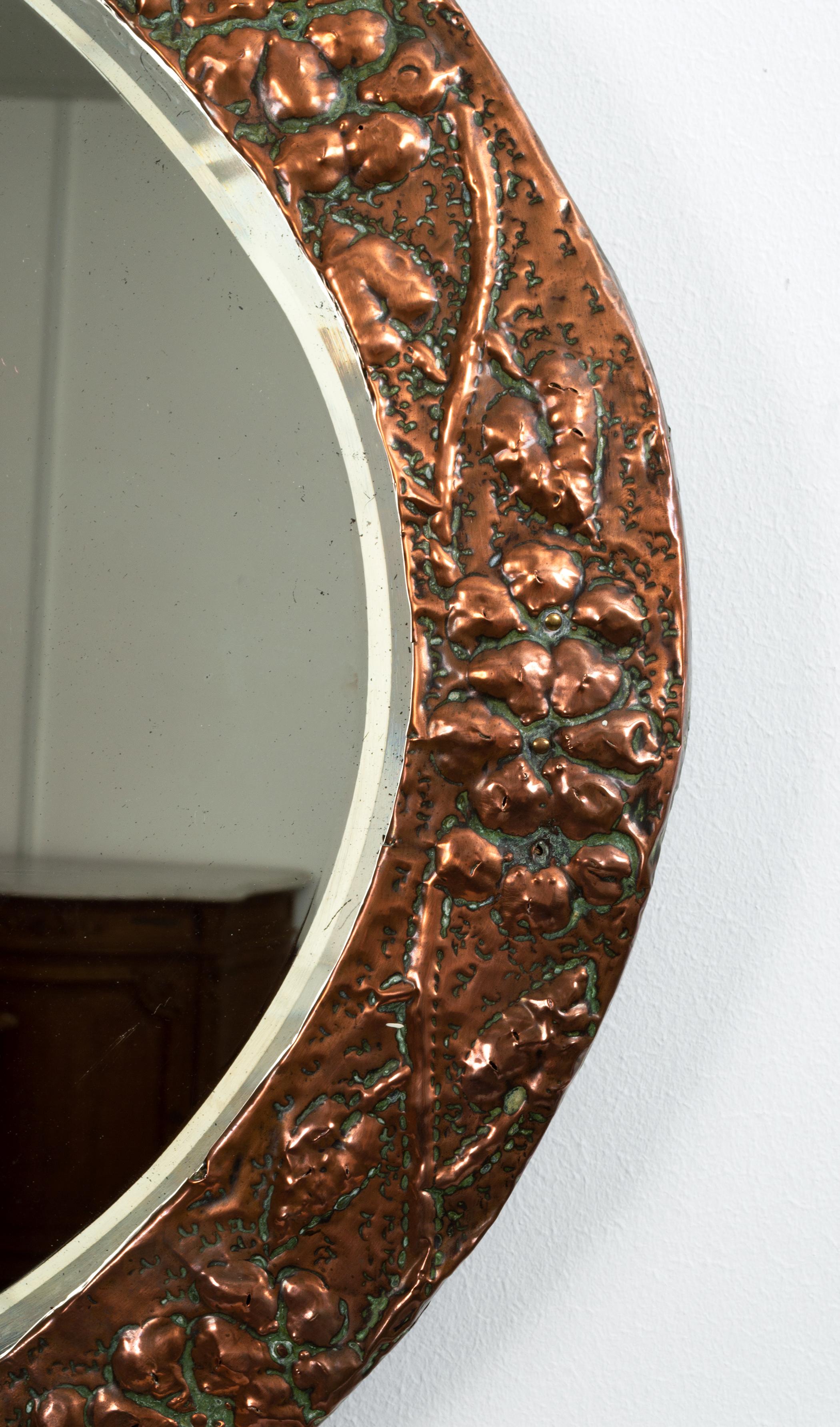 Large antique English Arts & Crafts copper oval mirror Keswick School C.1900 

Large oval copper framed Arts & Crafts mirror by the Keswick School of Industrial Arts C.1900
Superb repousse hammered trailing floral design.
An excellent example.