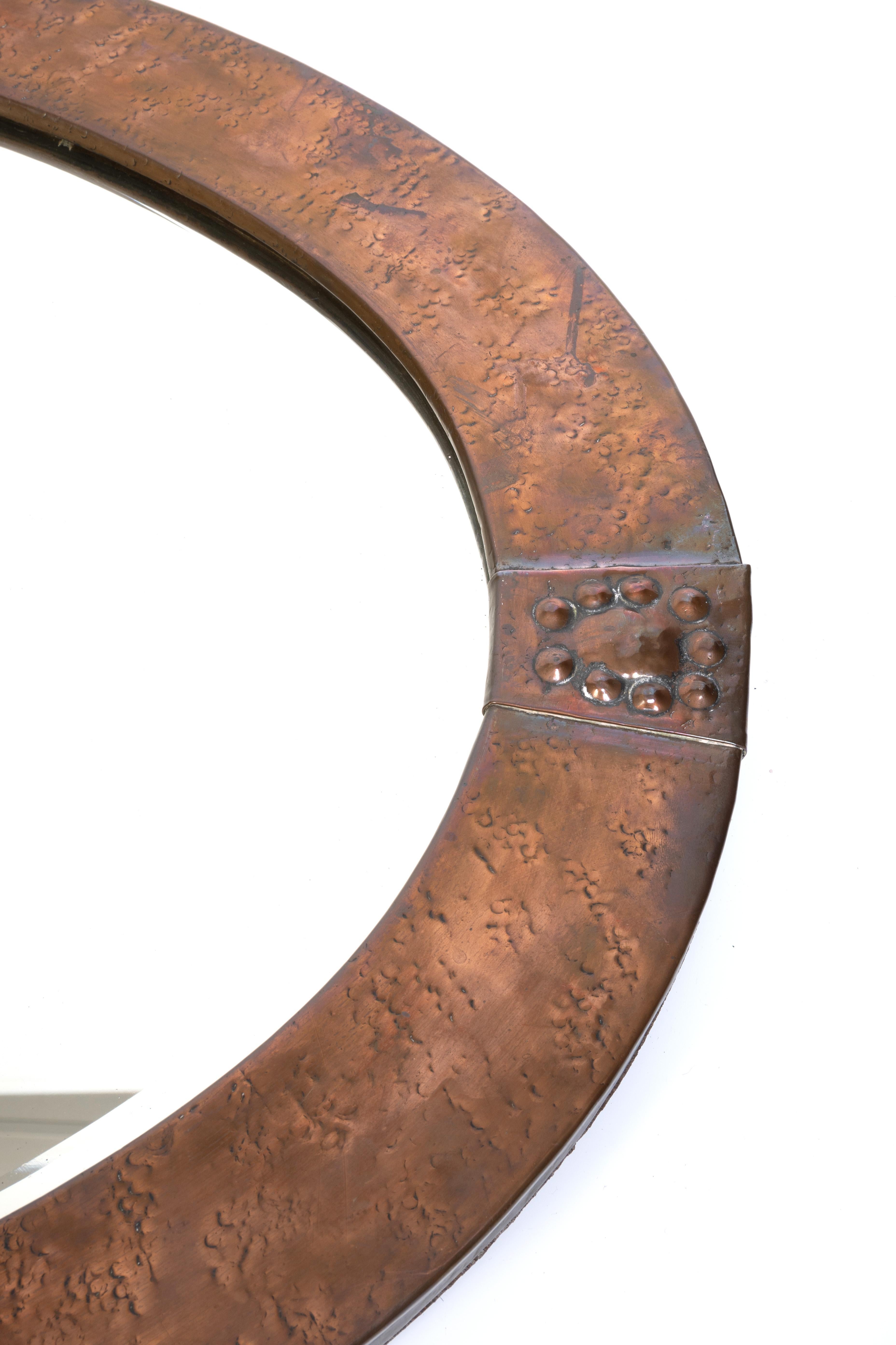 Early 20th Century Large Antique English Arts & Crafts Copper Oval Mirror Liberty & Co. For Sale