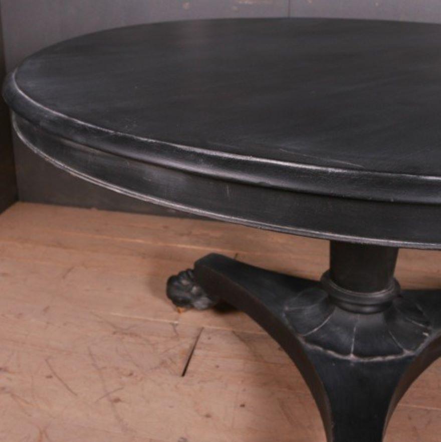 Large 19th century painted breakfast table with large carved paw feet, 1830.

Clearance under the rail is 26.5