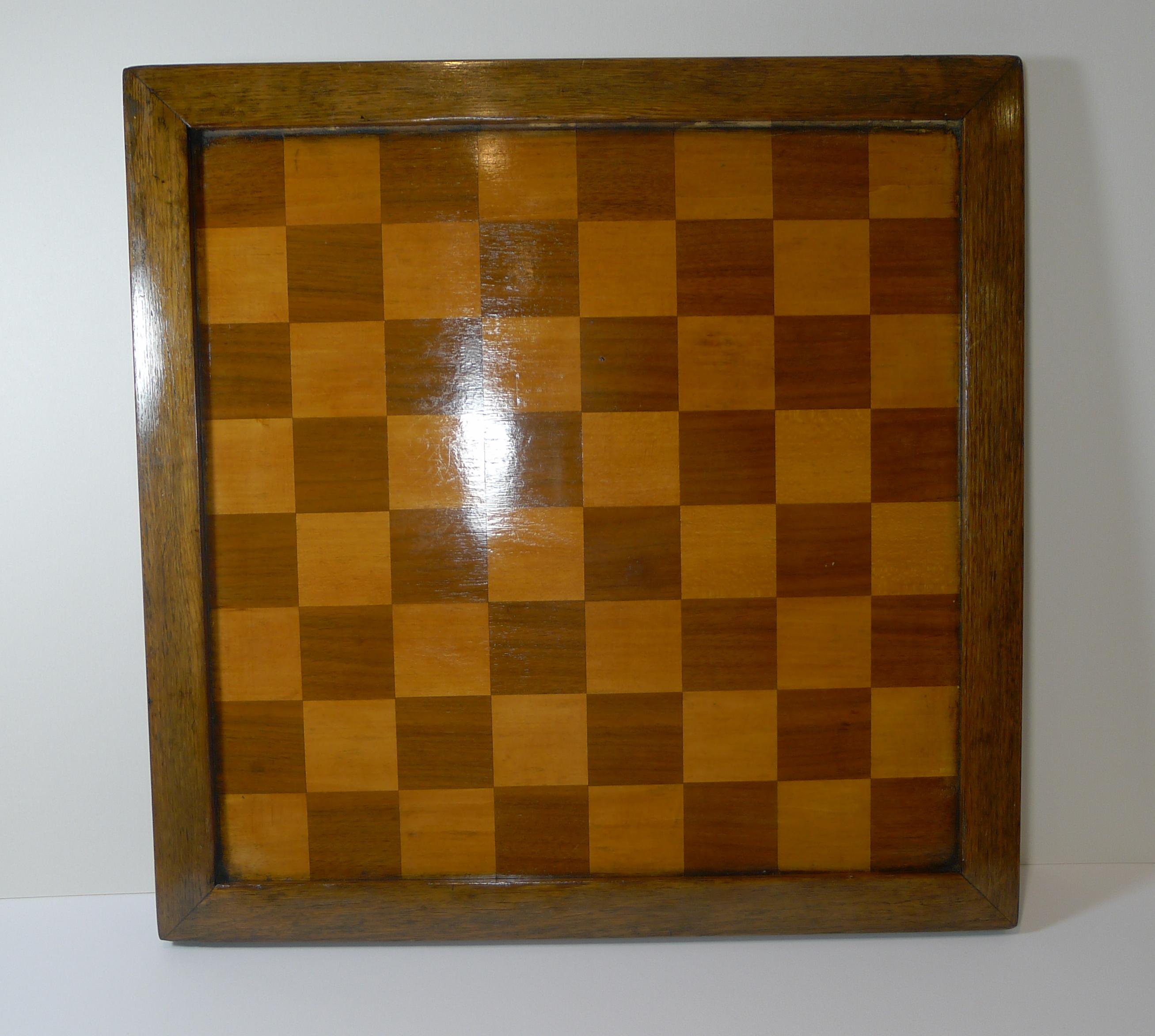 A handsome large English chess board consisting of two separate boards, one each side, one for Chess or Draughts, the other for French Draughts or Checkers (Jeu de Dames) which consists of a 10 x 10 pattern (100 squares). The other side is of course