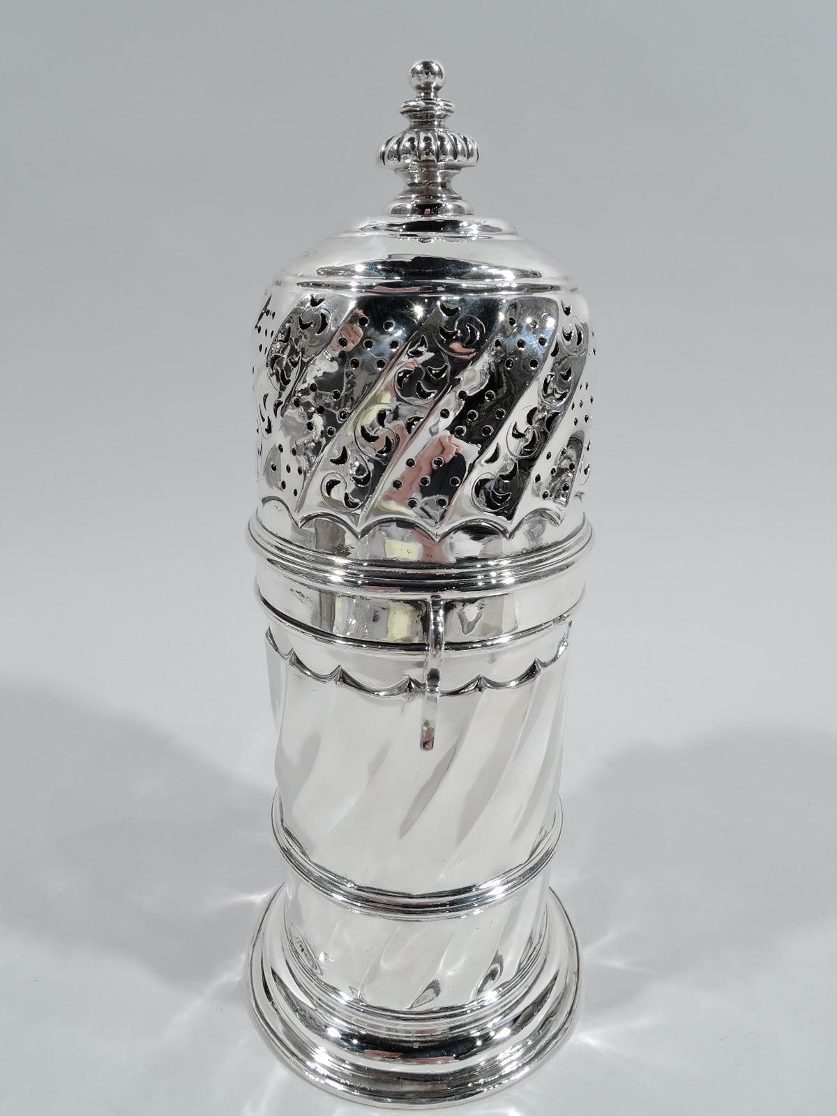 Victorian Classical sugar caster. Made by William Gibson & John Langman in London in 1893. Girdled body on stepped foot. Twisted fluting with scalloped borders. Cover has ornamental piercing and finial. Initials EAW engraved on underside. Elegant