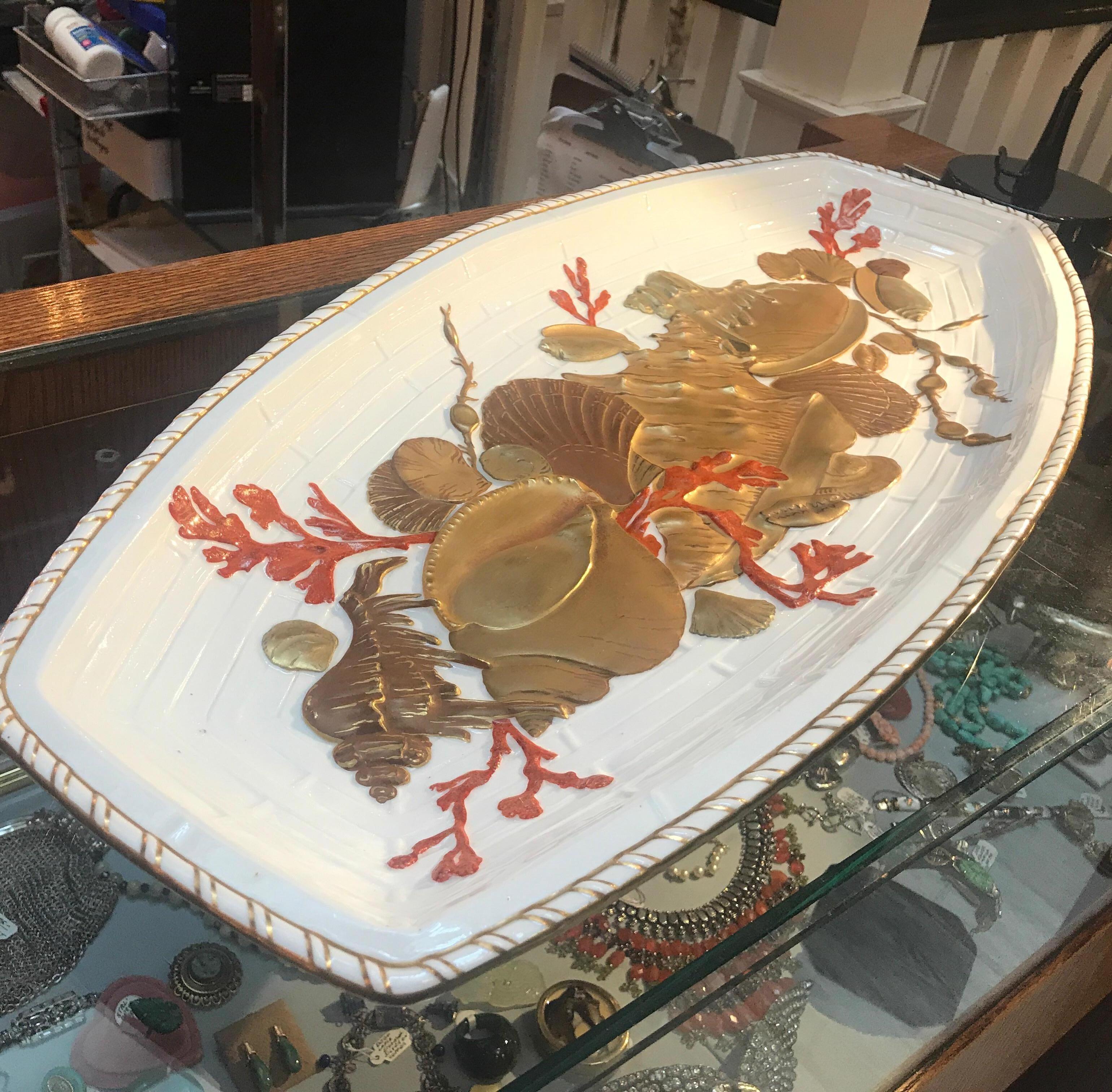 Fabulous and unusual English porcelain hand painted fish platter by Wedgwood 1880s the white glazed porcelain with three color gilt shell decoration with orange red coral highlights. The bowl of the platter with highly dimensional assortment of