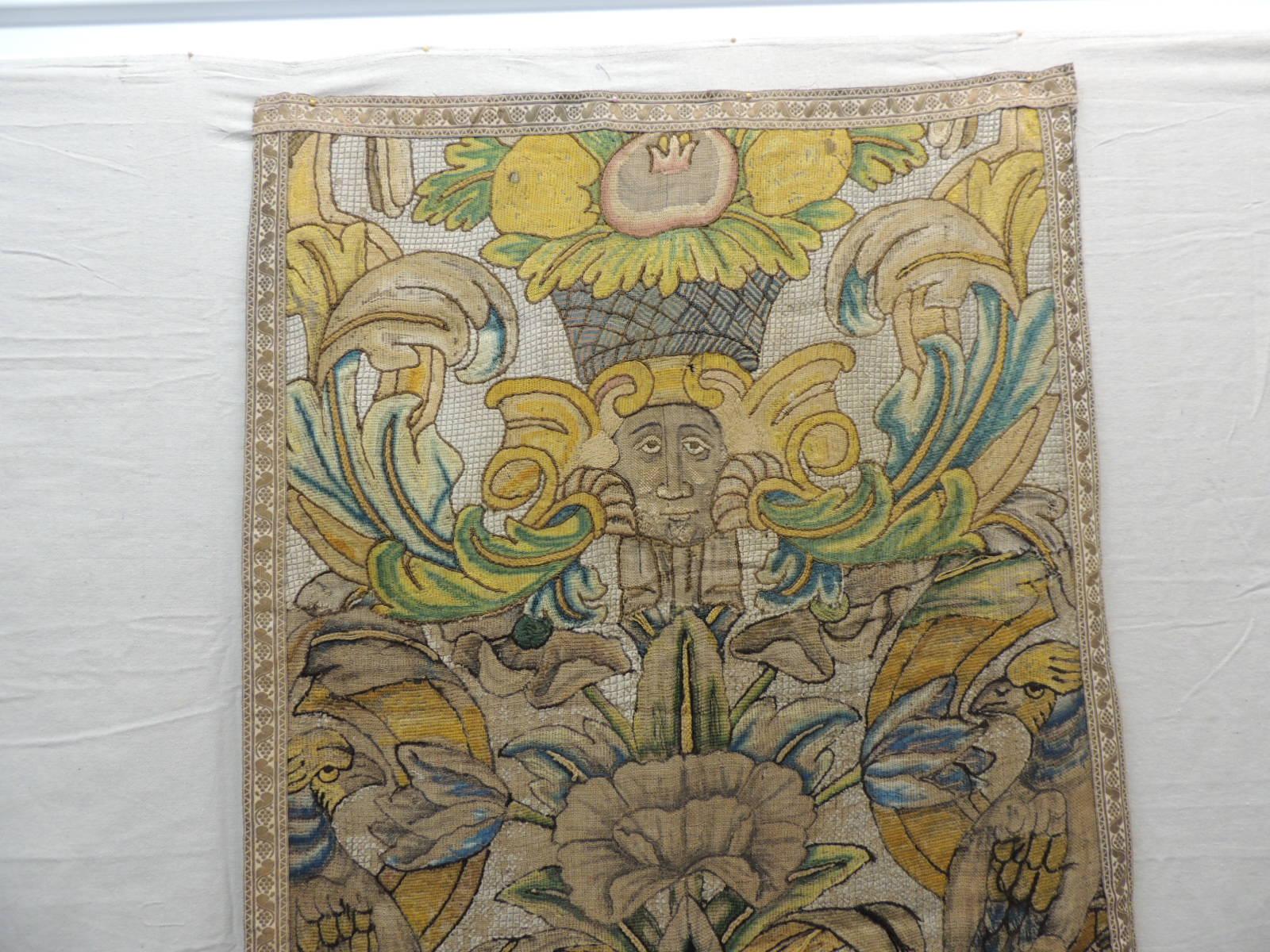 Large antique English needlework tapestry wall hanging.
Framed with gold metallic threads antique trim and backed with linen.
British Colonial scene depicting fruits, birds, flowers, cornucopia, faces,
acanthus leaves and lions.
In shades of gold,