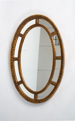 Grande specchio ovale inglese neoclassico in legno dorato e gesso, 1910 ca.