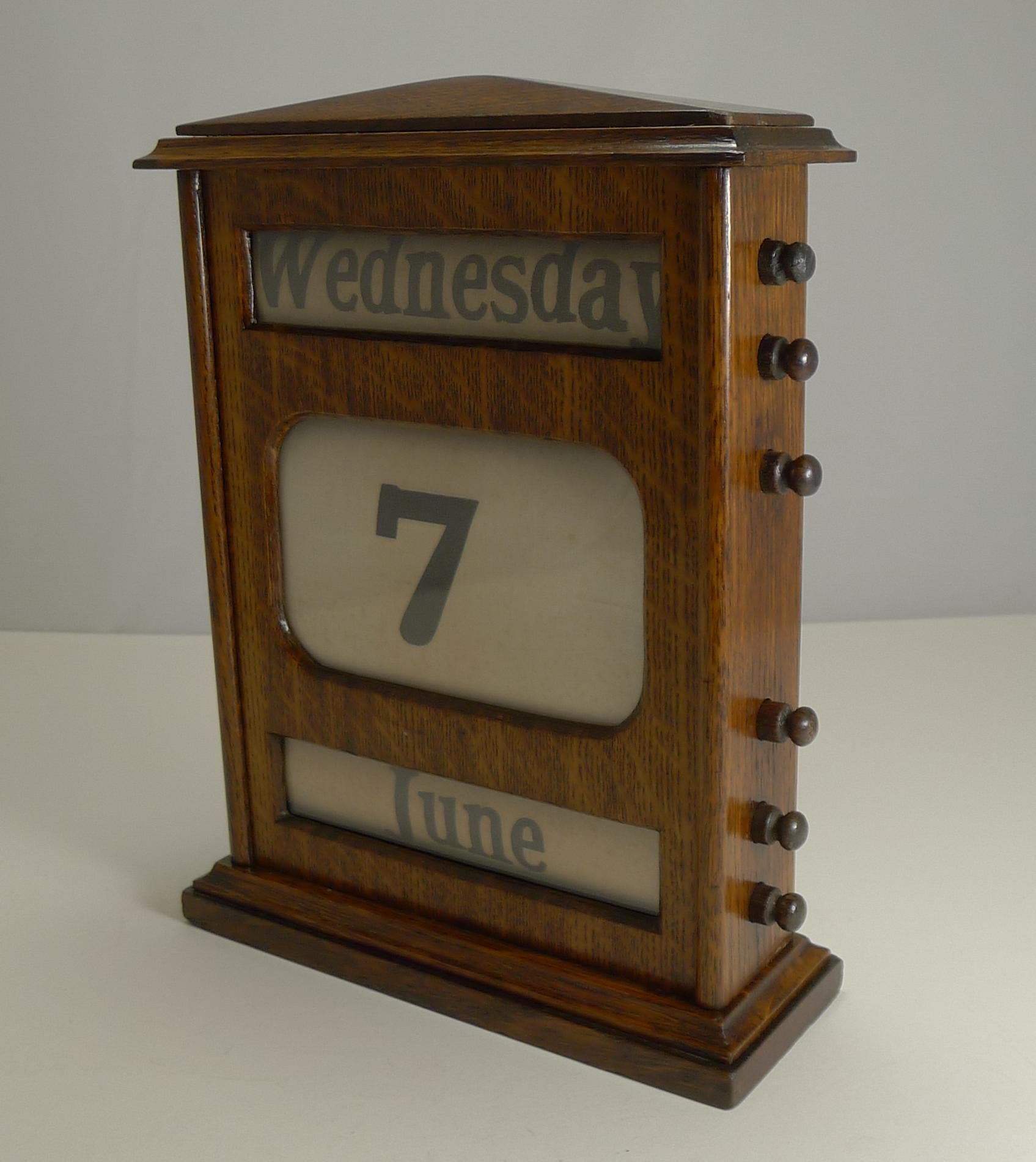 A good large Edwardian perpetual calendar made from solid English oak. The keys either side are used to forward and return the rollers inside, changing the day, date and month.

Dating to circa 1900, it remains in excellent condition, normal marks