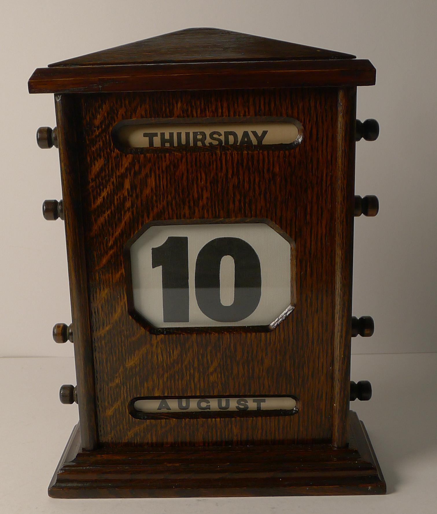 A good large Edwardian perpetual calendar made from solid English Oak. The keys either side are used to forward and return the rollers inside, changing the day, date and month.

Dating to c.1900, it remains in excellent condition.

A good size