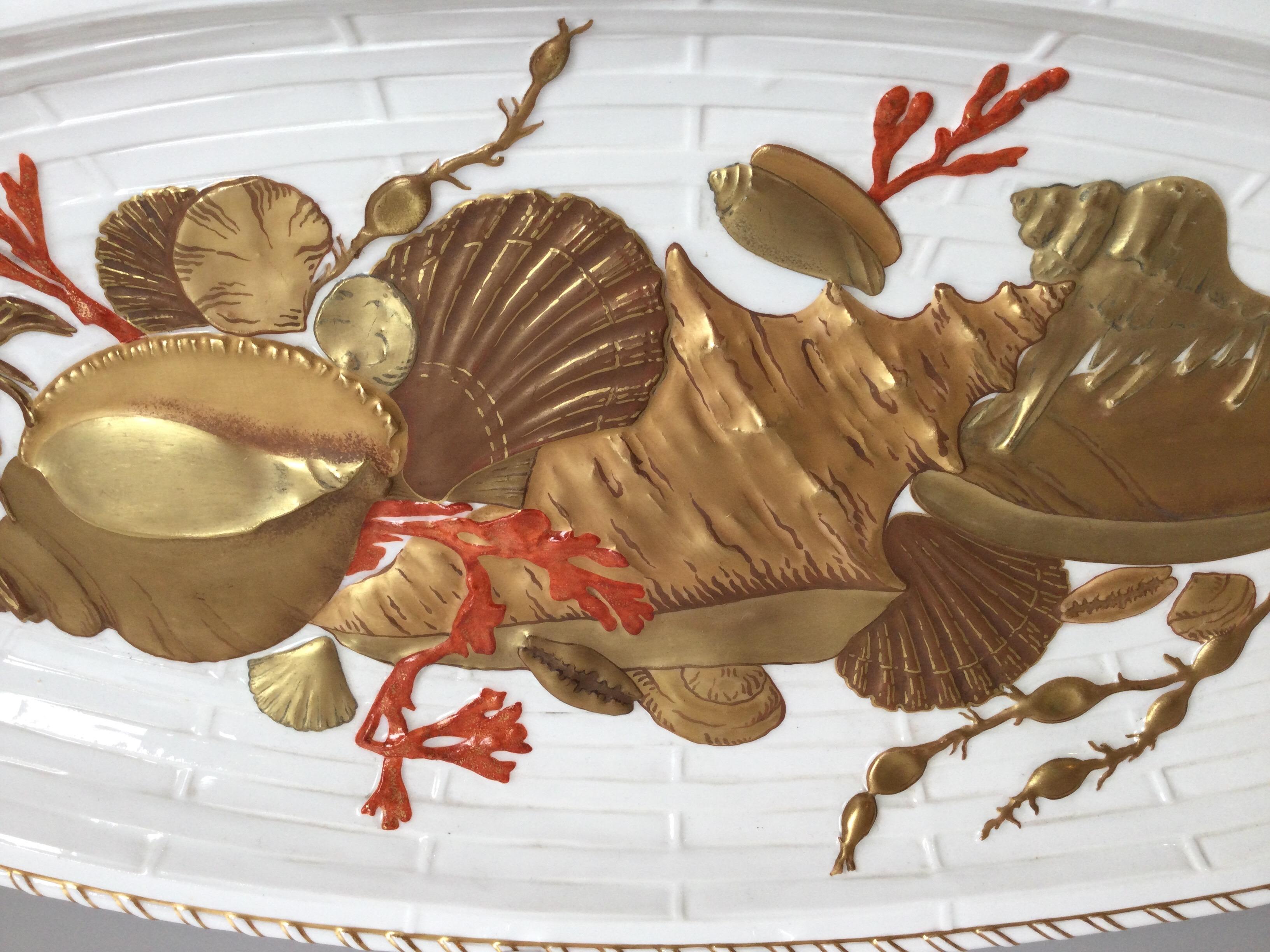 Unusual English porcelain hand painted fish platter attributed to Wedgwood 1880s.  the white glazed porcelain with three color gilt shell decoration with orange red coral highlights. The bowl of the platter with high relief three dimensional