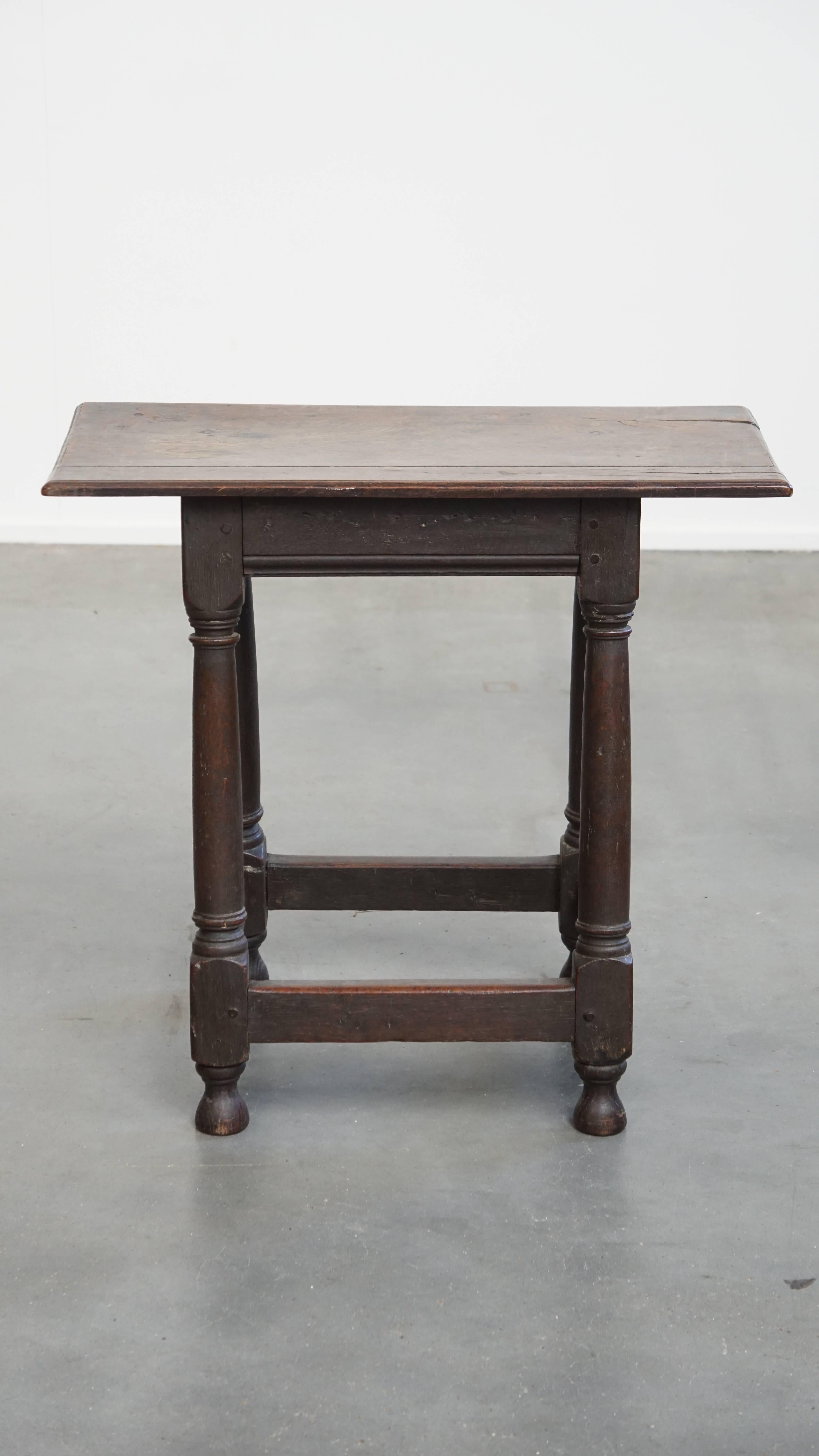 Offered here is this charming and exceptionally large antique English side table or stool with a beautiful patina. 

This piece masterfully combines elegance and function. Thanks to its sturdy construction, it can serve not only as a stylish side