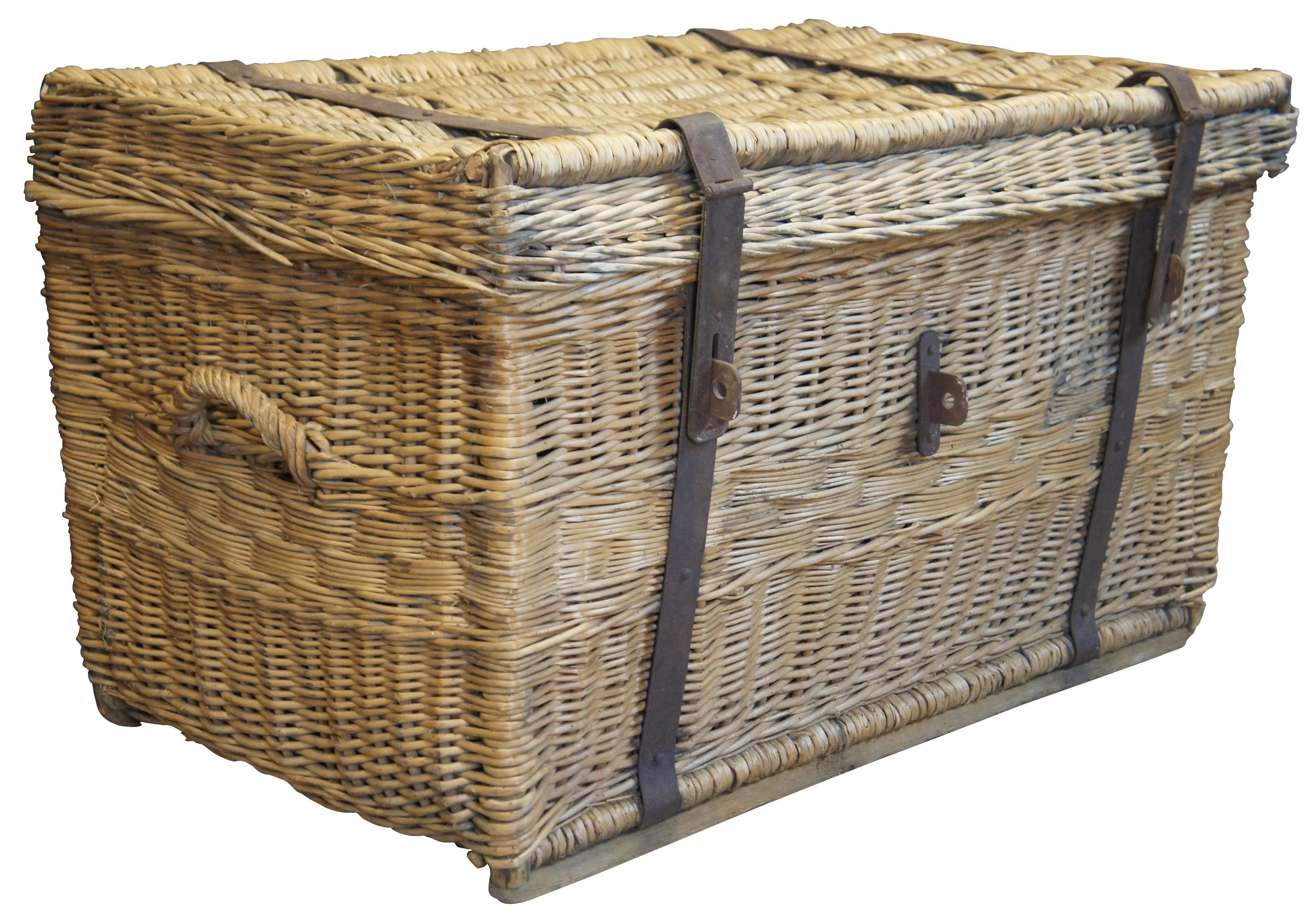 Early 20th century European wicker trunk. A nice oversized carrier with iron locking system. Features handles on each side. Great for use as a hamper, table or accent piece.
 