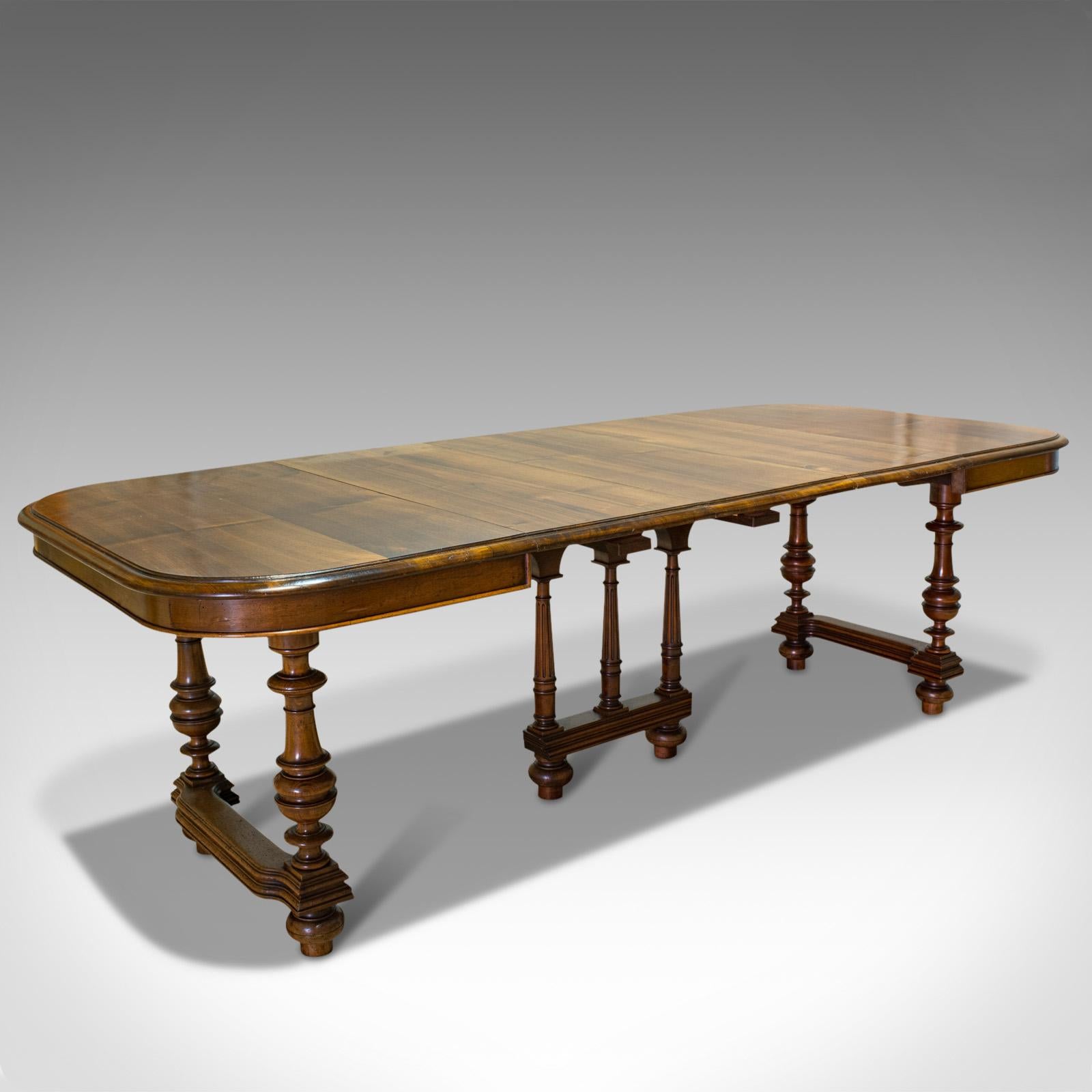 This is a large antique extending dining table. A French, walnut buffet table seating 4-10 people, dating to the late 19th century, circa 1900.

A grand, continental dining table
Displays a desirable aged patina
Select walnut shows wonderful