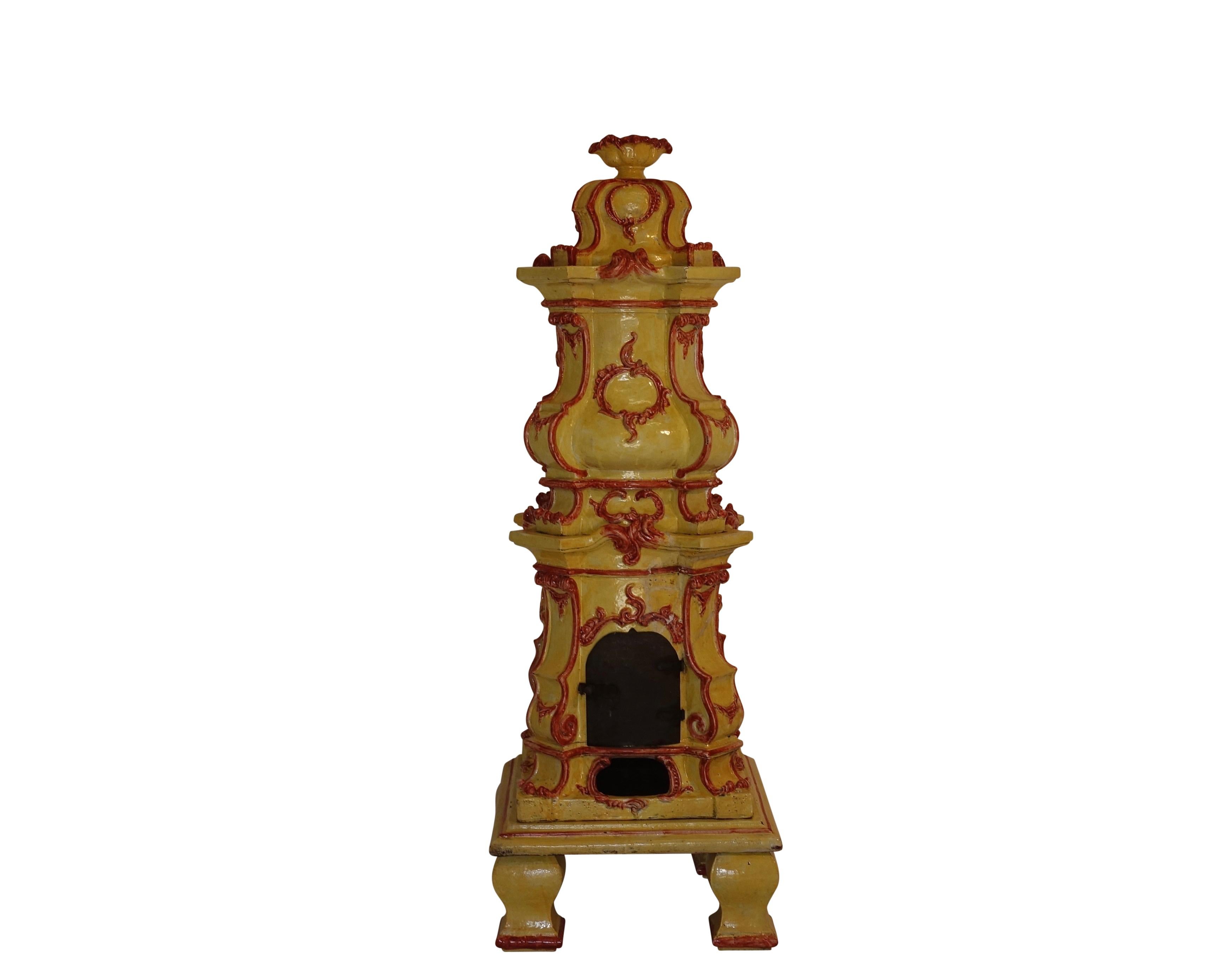 Ornate finial above serpentine and bombe sections modeled with scrolling foliage rocaille cartouches and ornamentation. Hinged cast iron door on firebox resting upon flat plate and four block feet. Stove is in six sections.
European, 19th century.