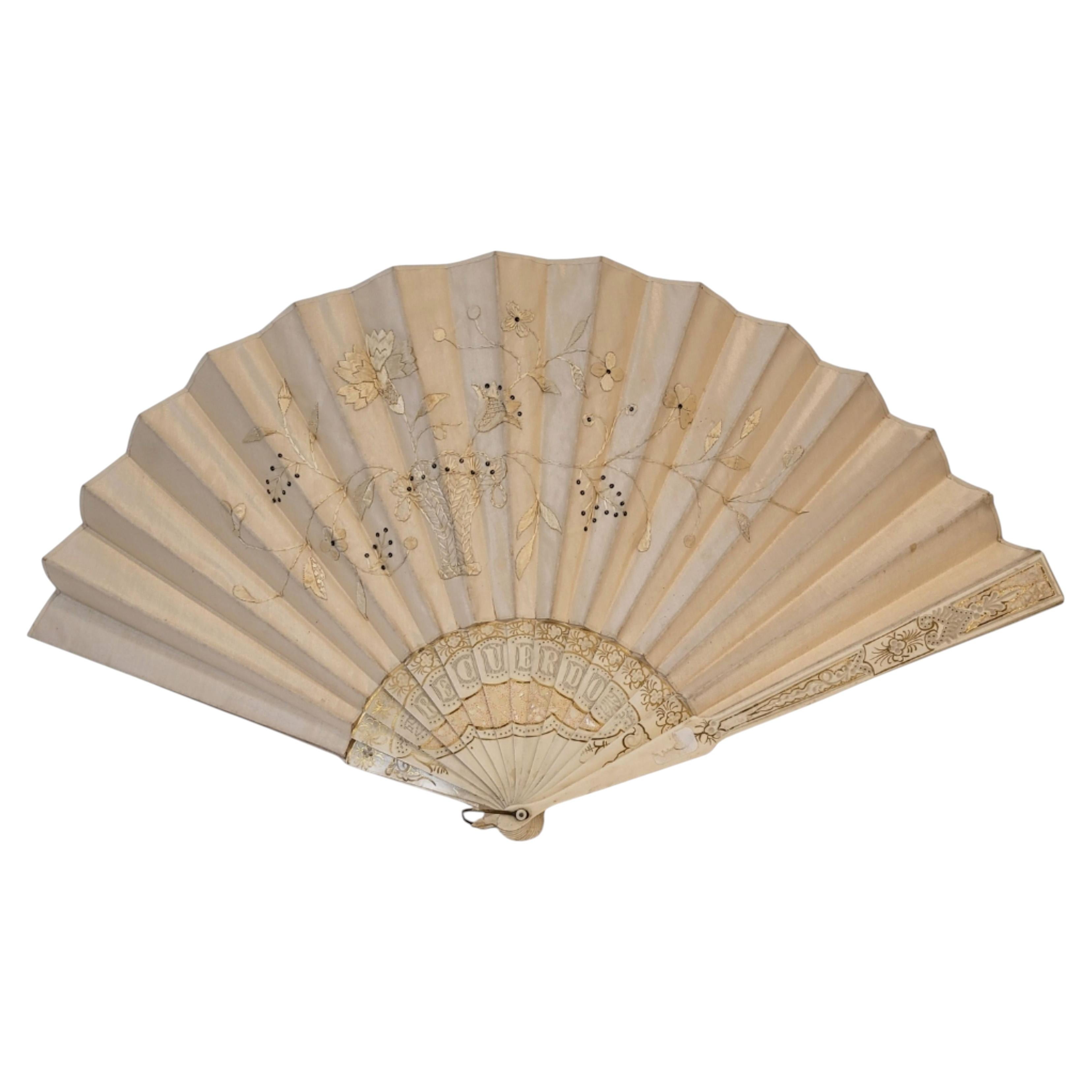 Large antique fan in embroidered champagne and bone-colored silk