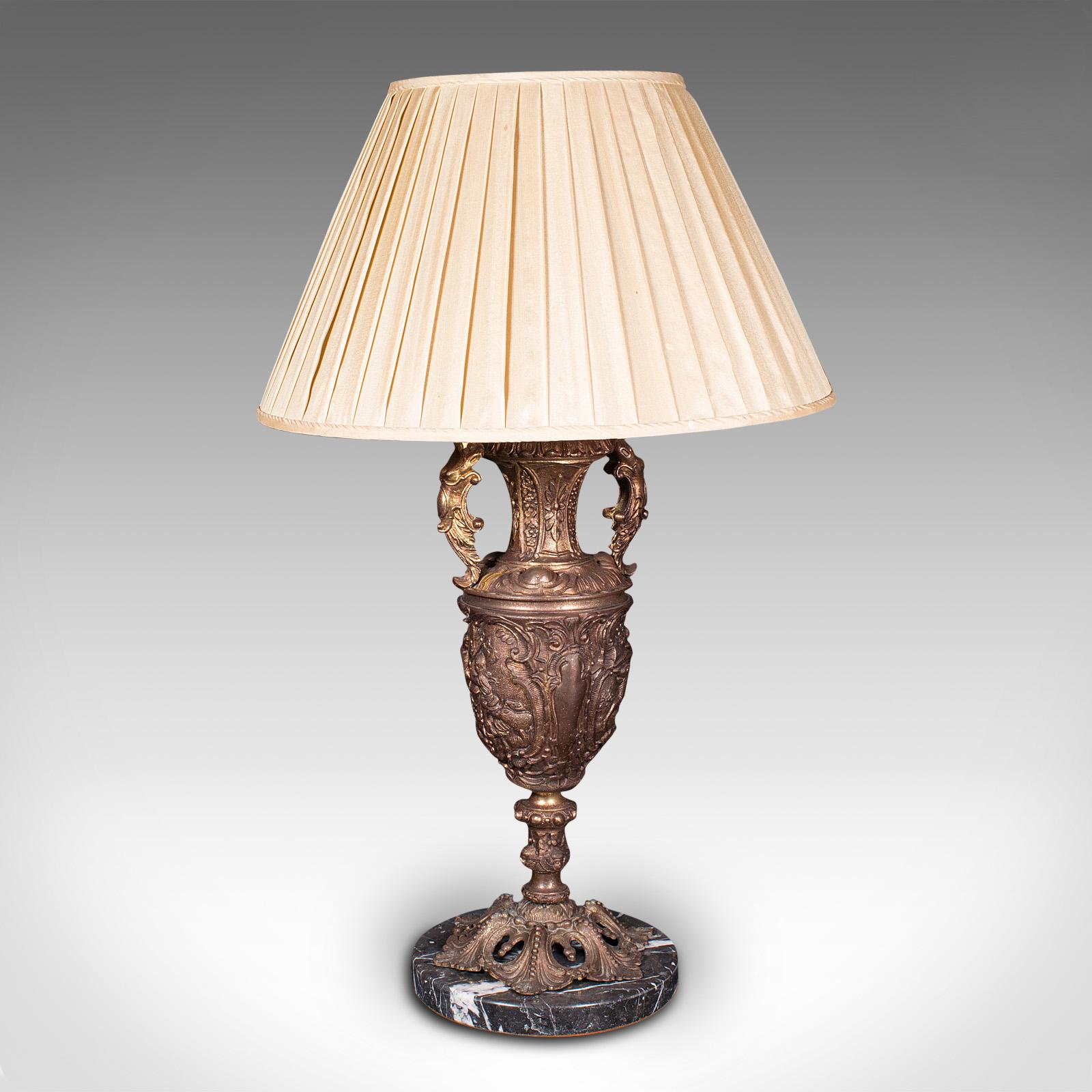 This is a large antique feature lamp. An Italian, gilt metal and marble heavy table light, dating to the late Victorian period, circa 1900.

Striking and substantial, with superb decorative appeal
Displaying a desirable aged patina and in good