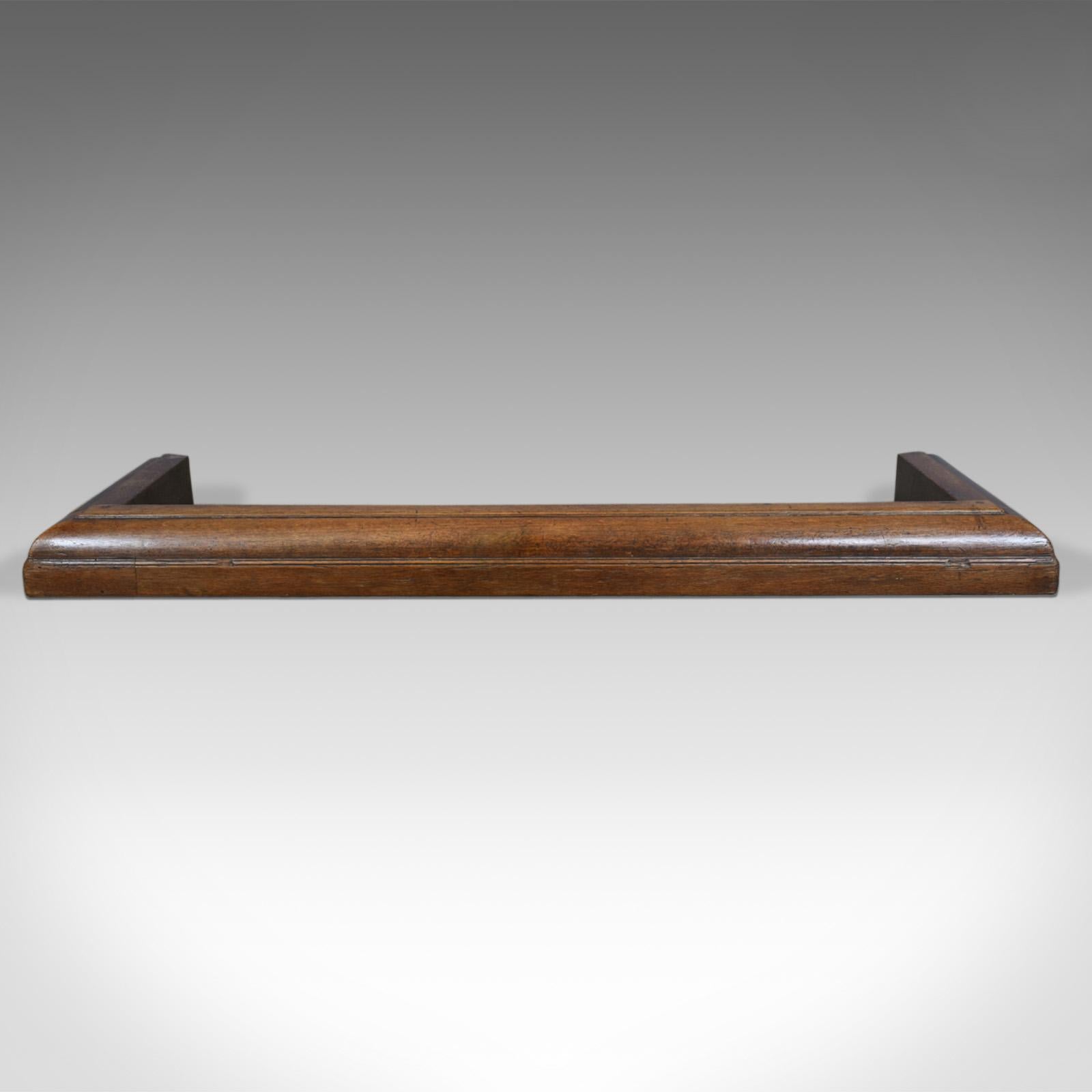 This is a large antique fire kerb, English, Victorian, oak fireside fender, circa 1870. 

Larger than most and with a glorious aged patina
Heavy, English oak presenting good colour
Classic modest lines to the molding
Ideal for most
