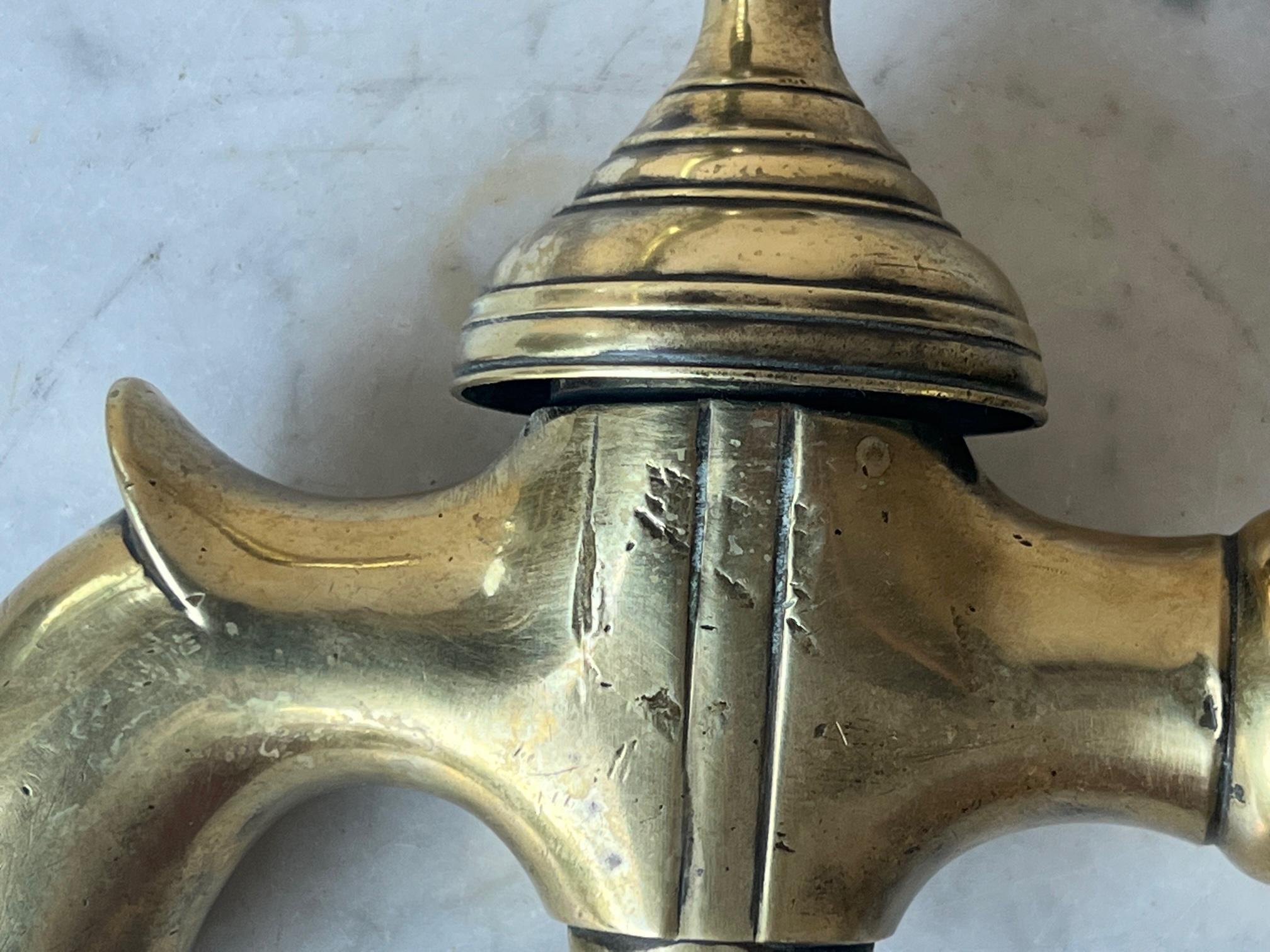 Antique brass faucet made in France around the 1920's to 1930's . Could be configured to fit a modern pipe. The handle turns and the faucet is functional.