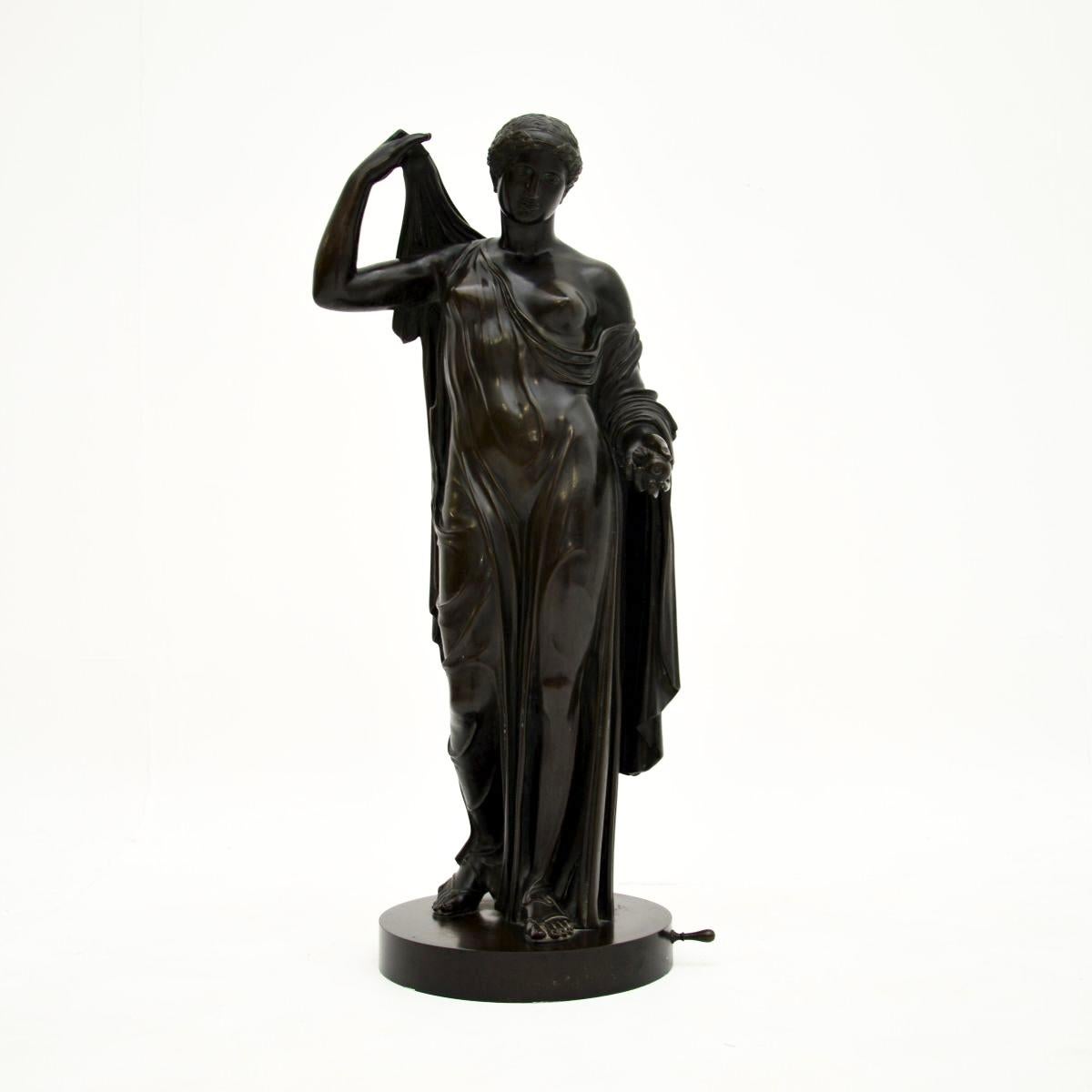 A very impressive & large antique French bronze neoclassical robed lady. We would date this to around the 1880-1900 period.

It is of extremely fine quality, depicting the figure of a classical robed lady. The details are exquisite, from the robes