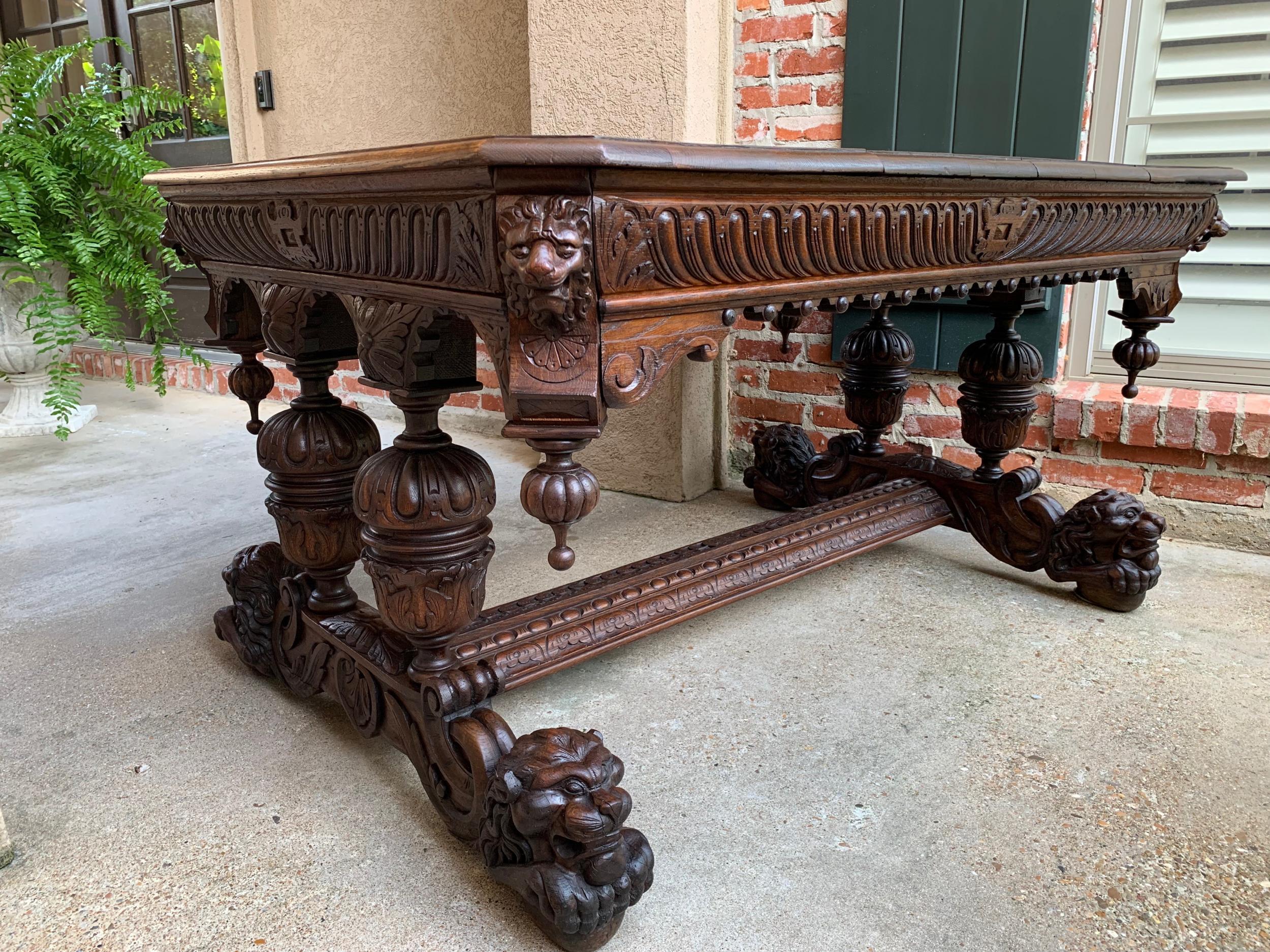 Large antique French carved oak dining table library desk Lion Renaissance 19thc

~Direct from France~
~A stunning 19th century French carved oak dining table, with huge, dimensionally carved LION feet!~
~Versatile size-as presented, this piece